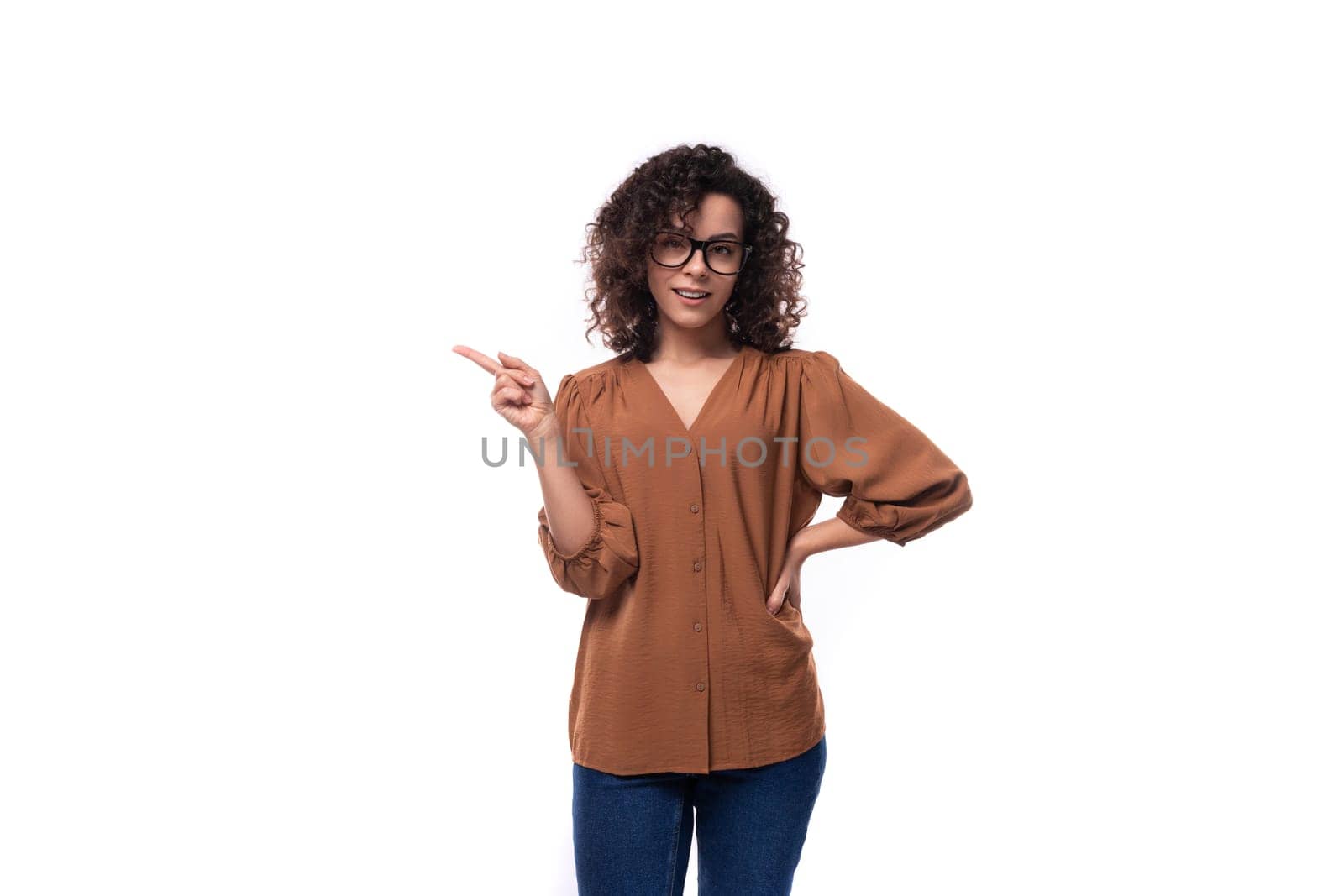 young confident successful curly leader woman wearing brown blouse by TRMK