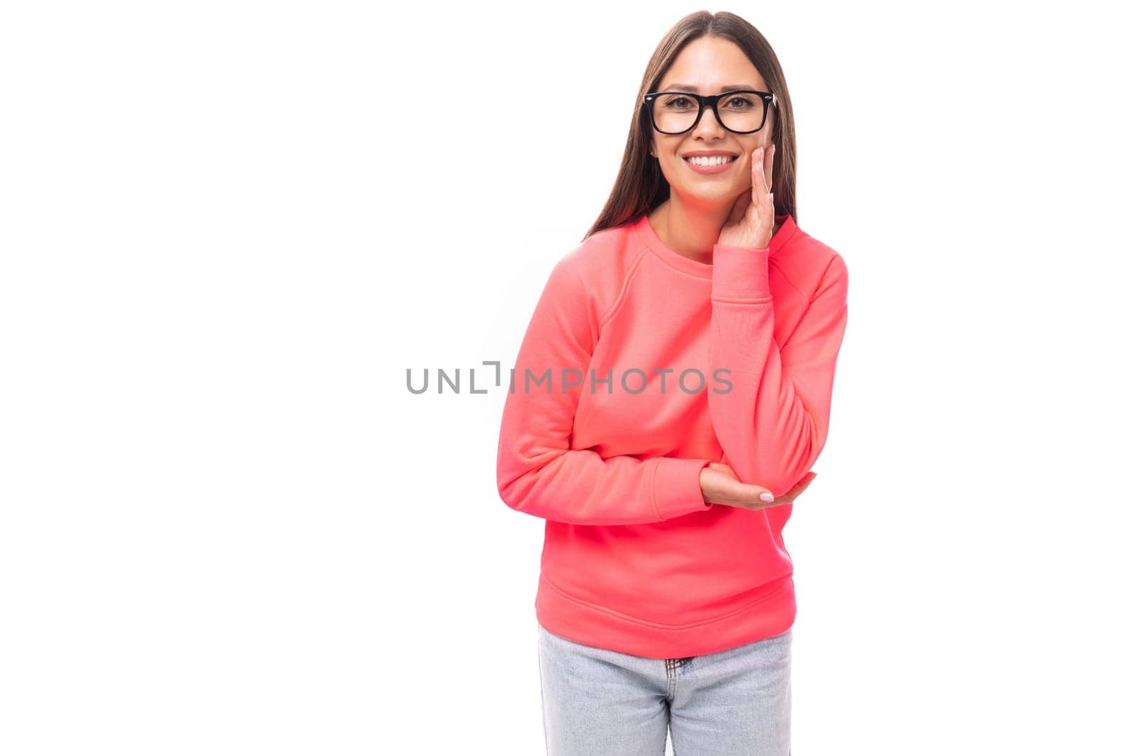 cute happy slim young brunette european woman dressed in pink sweatshirt over isolated background with copy space by TRMK