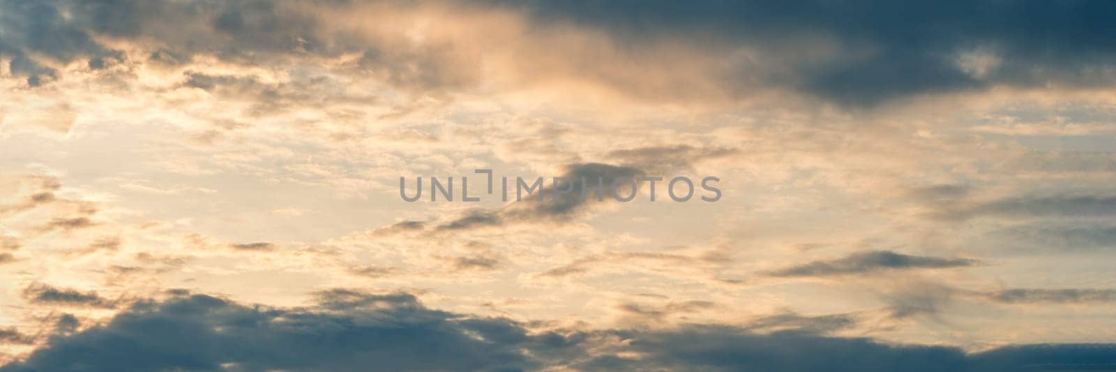 Abstract background sky Dawn Sunset Contrast dark shadow bright cloud sun orange silhouette above the mountains near the sea.