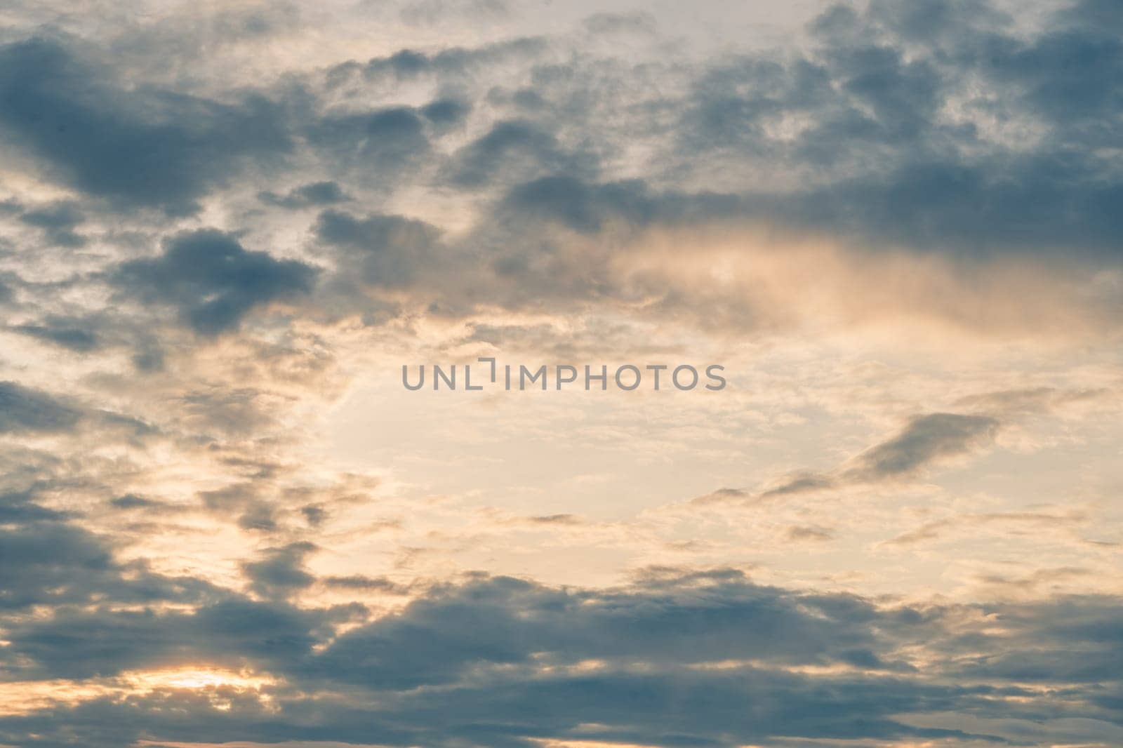 Abstract background sky Dawn Sunset Contrast dark shadow bright cloud sun orange silhouette above the mountains near the sea.