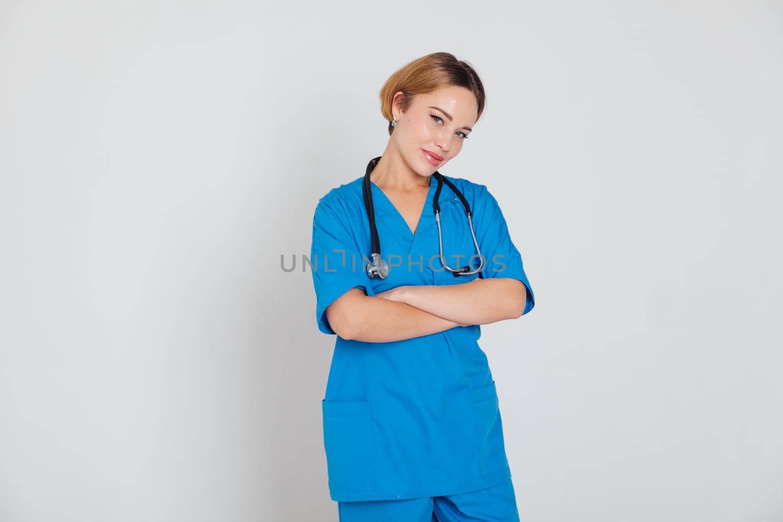 female doctor in blue suit with phonendoscope stethoscope in hospital hospital by Simakov