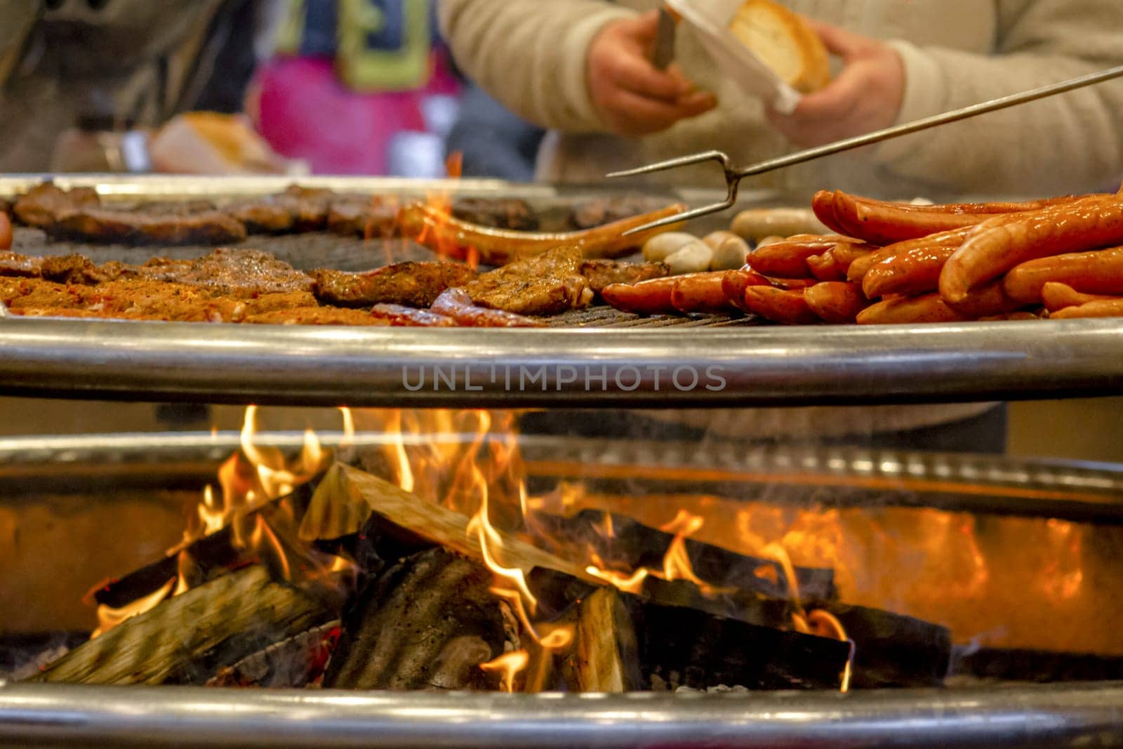 Grilling sausages on barbecue grill. Selective focus. High quality photo