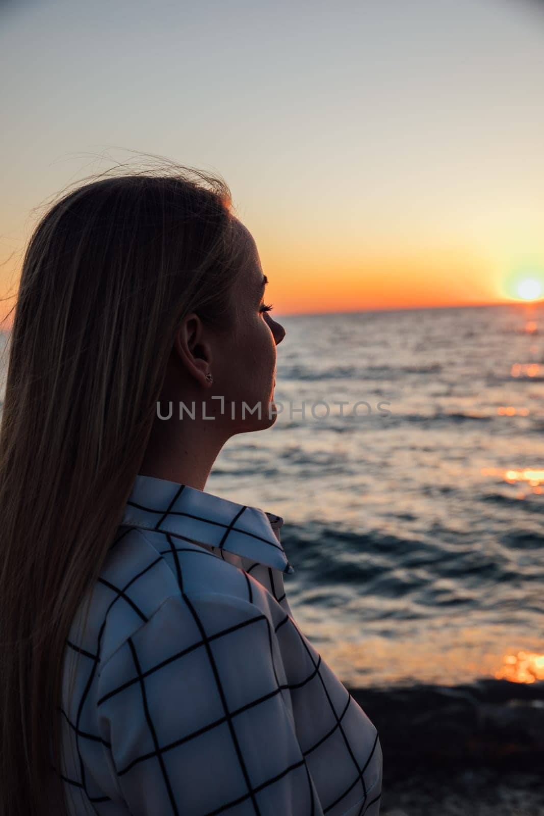 portrait of woman with her eyes closed by the sea in nature