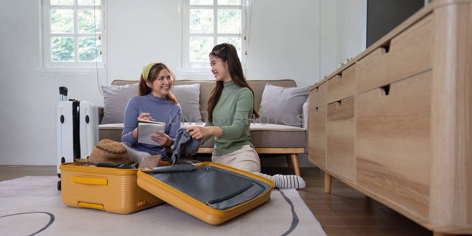 Woman packing a suitcase for a new travel trip. bag and luggage for journey.