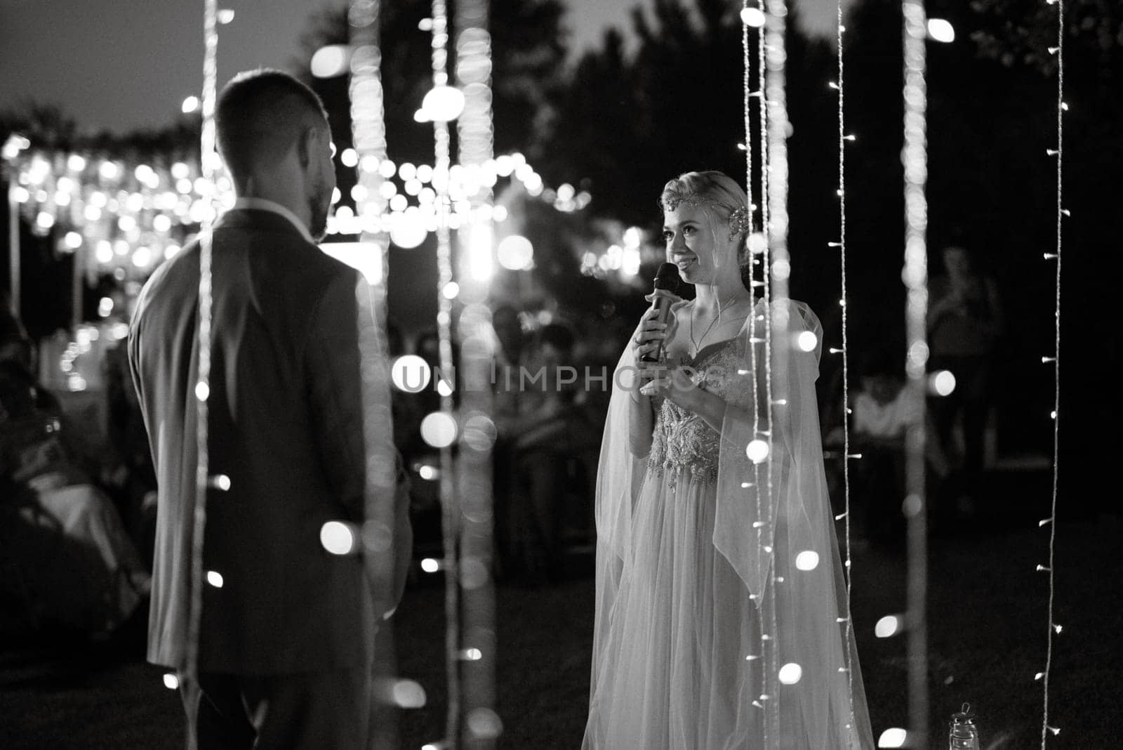 night wedding ceremony of the newlyweds in a country cottage by Andreua