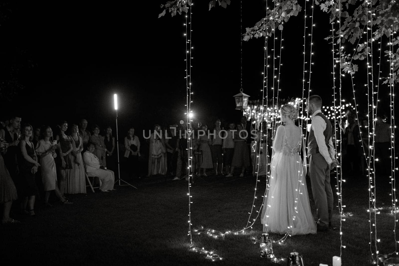 newlyweds happily cut and taste the wedding cake by Andreua