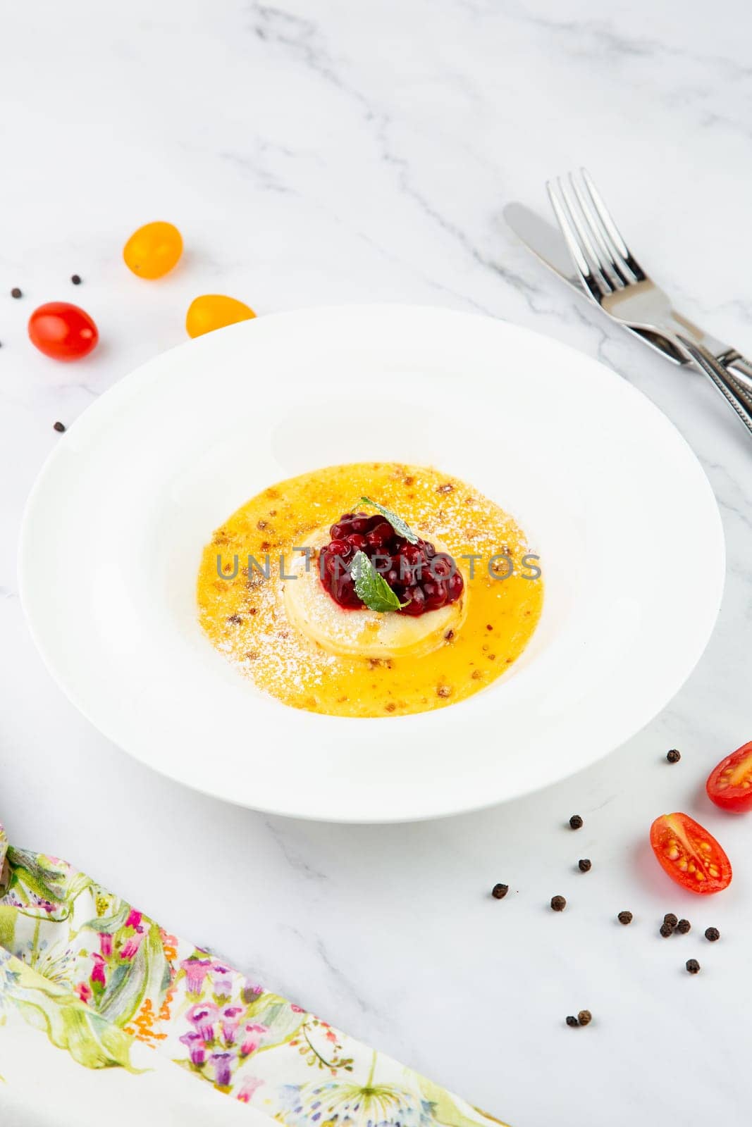 Ginger pumpkin soup with dumplings and berries. White background