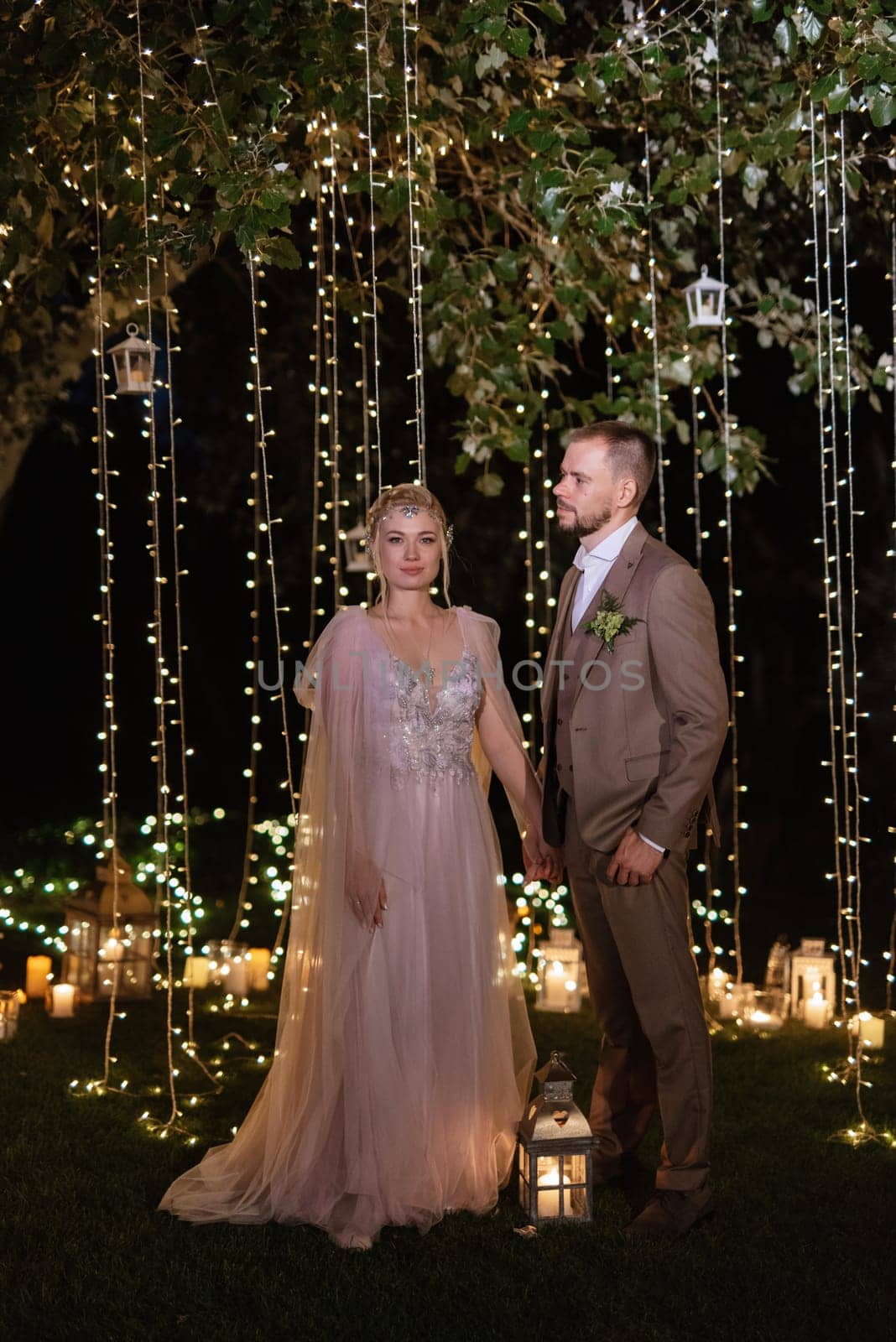 night wedding ceremony of the newlyweds in a country cottage by Andreua