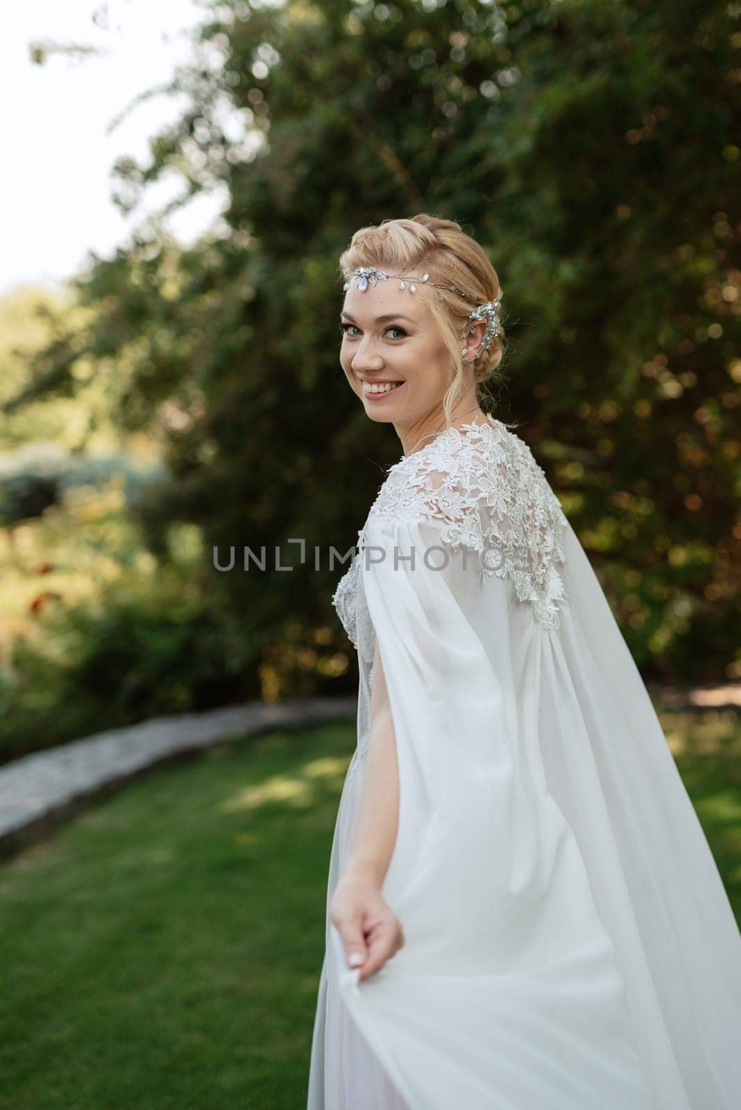 portrait of a happy bride in a light light dress in  wearing elven accessories by Andreua