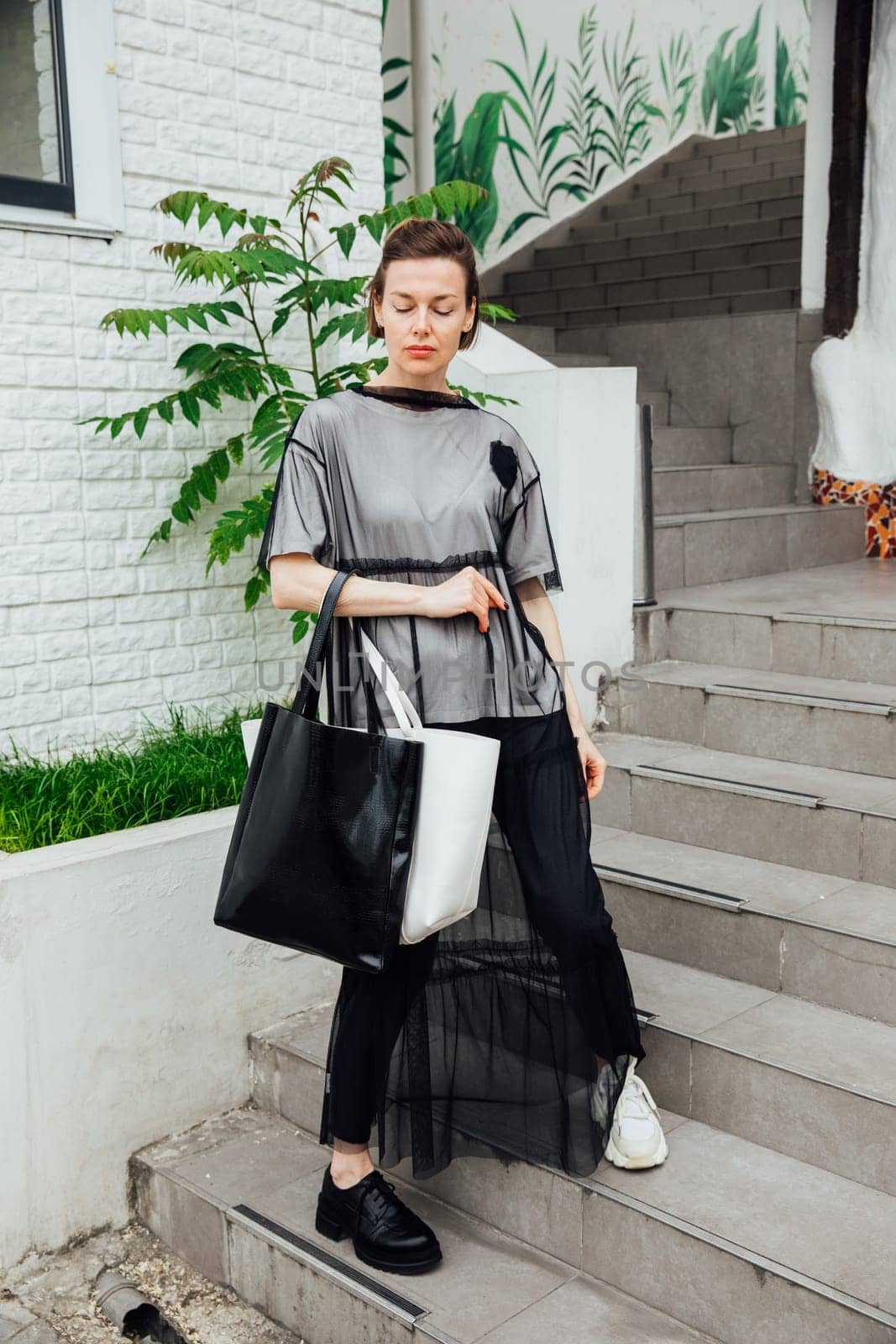 fashionable woman walking outdoors nice