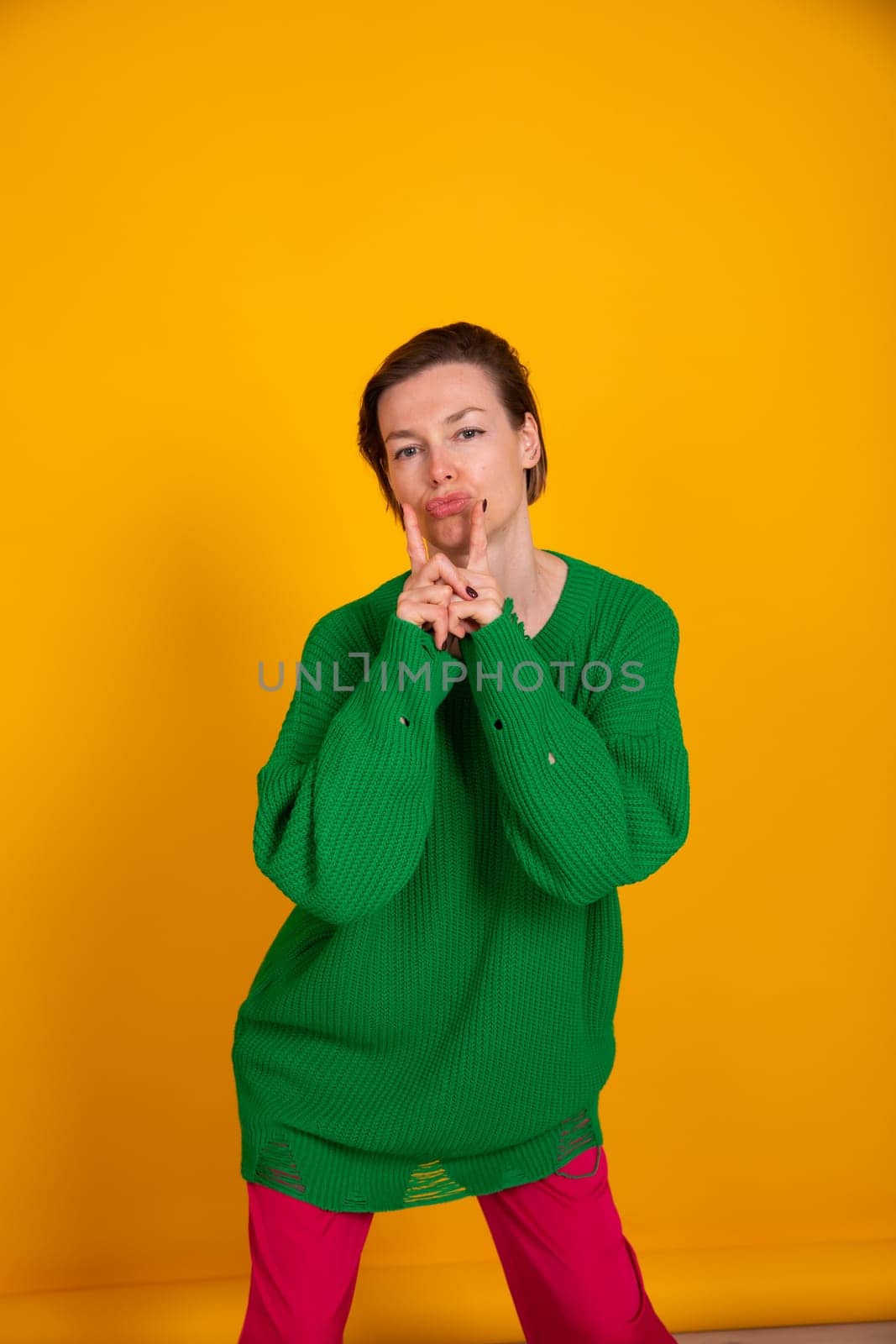 slender woman in green knitted autumn sweater
