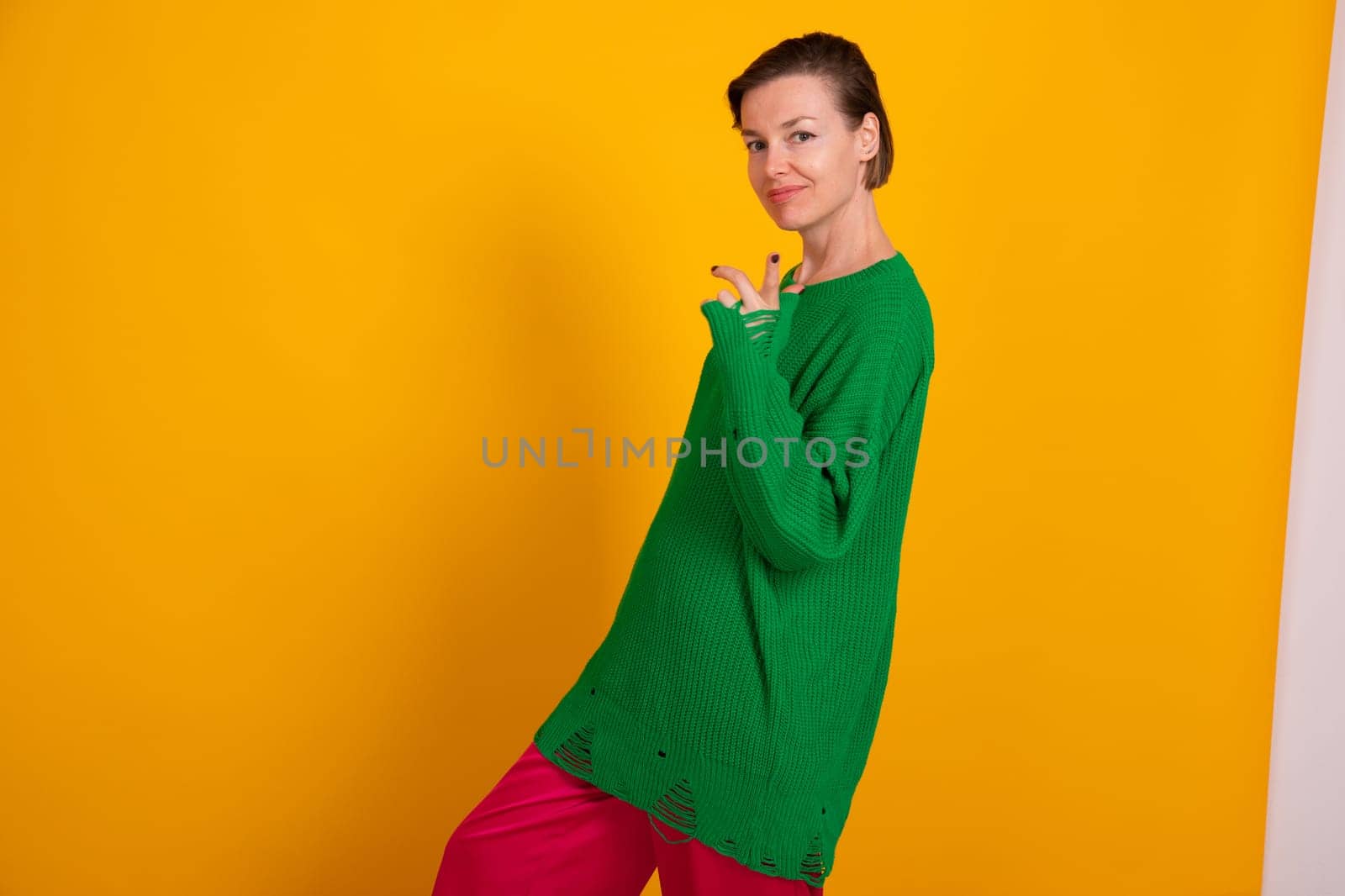 slender woman in green knitted autumn sweater