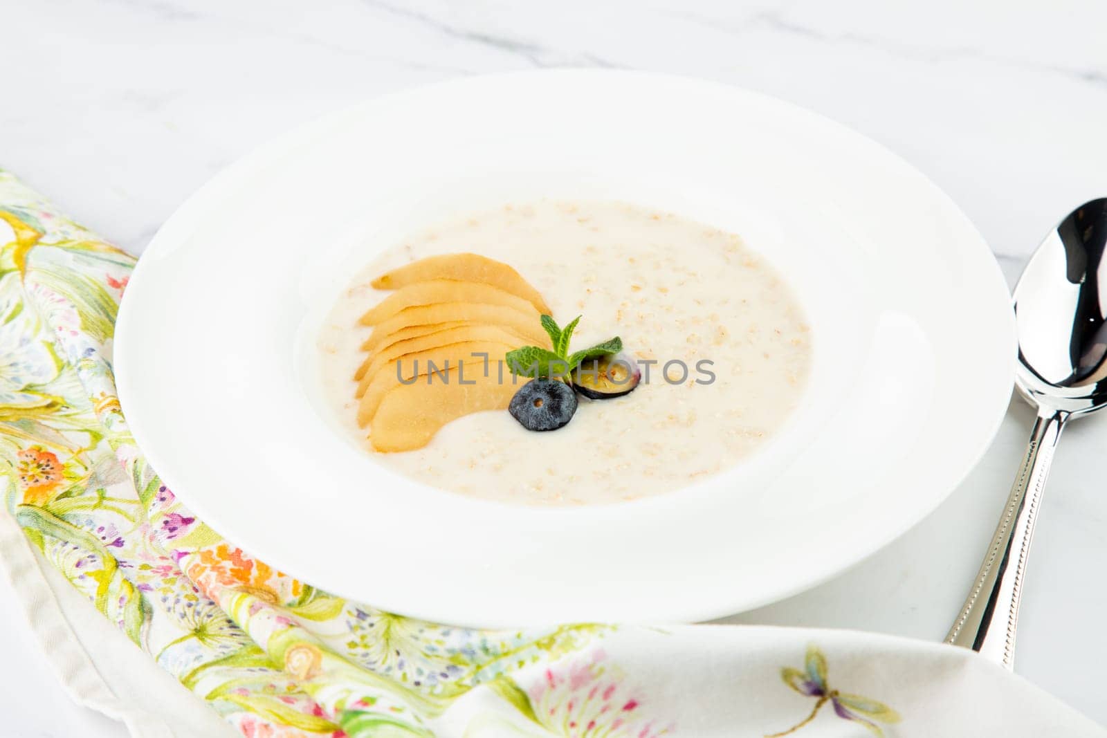 healthy breakfast with fruits in a white plate side view by tewolf