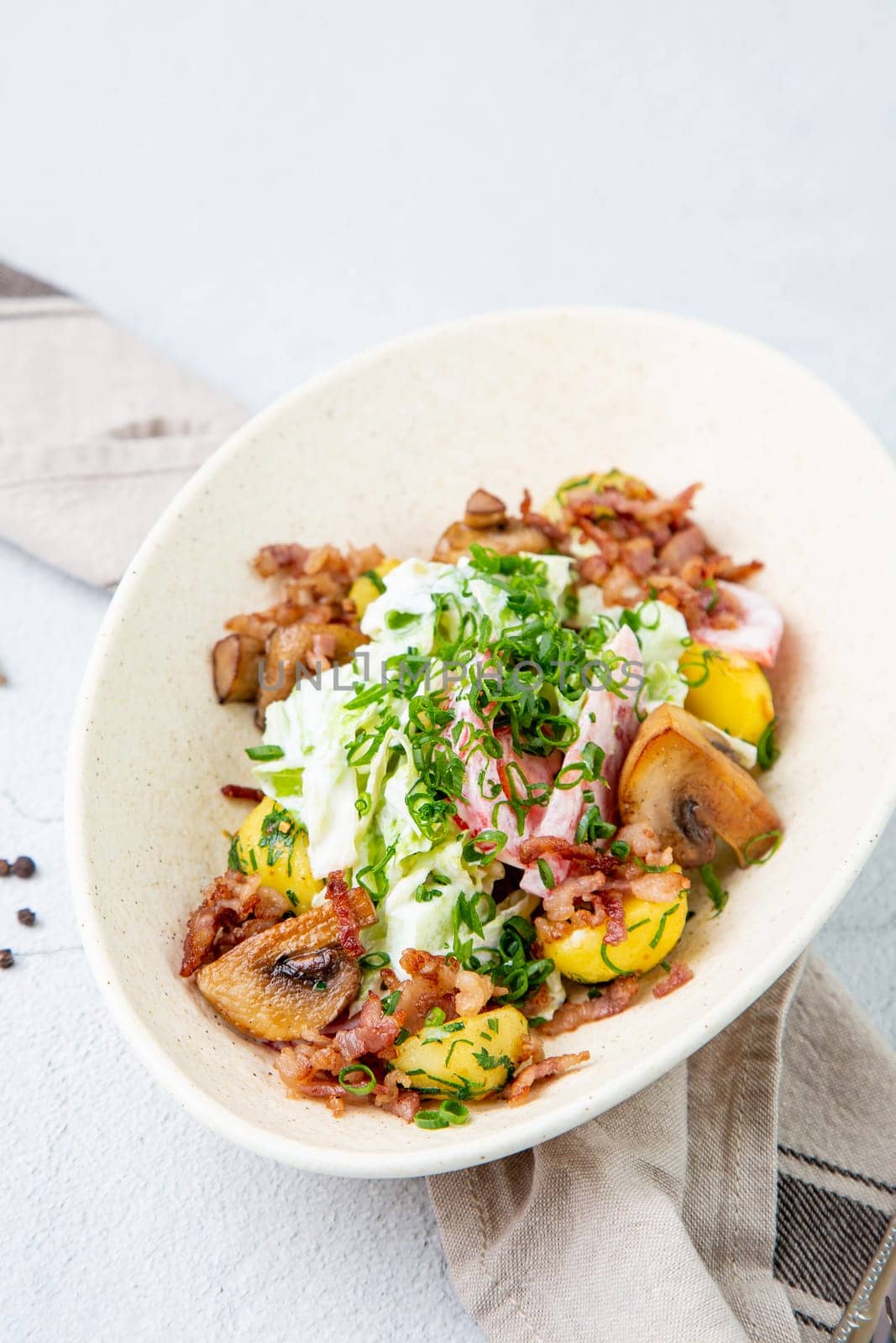 salad with potatoes, rice, meat and green onions top view by tewolf