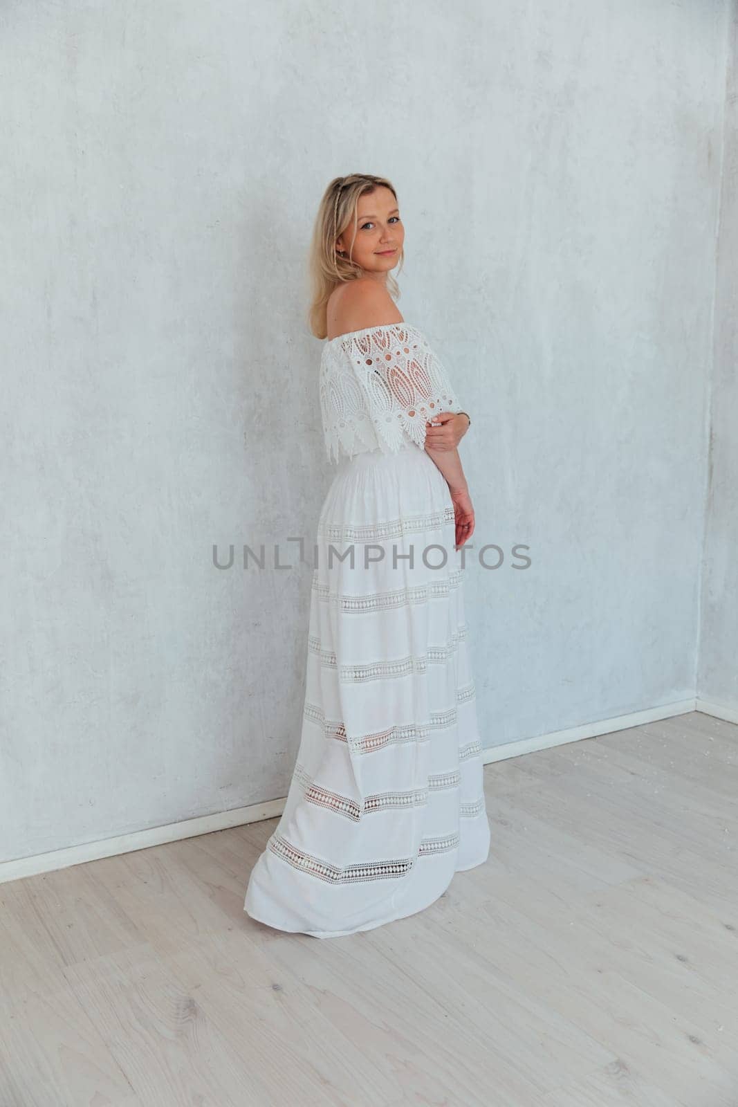 Beautiful blonde bride woman in summer knitted dress by Simakov