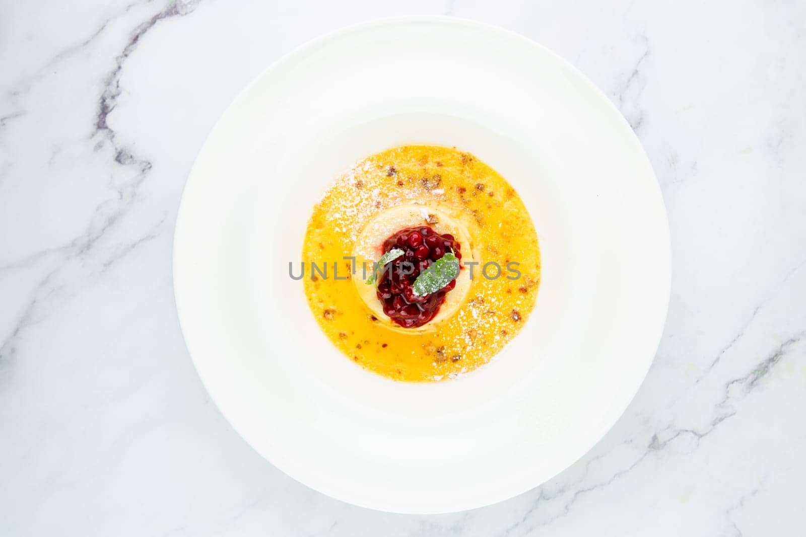 Ginger pumpkin soup with dumplings and berries. White background