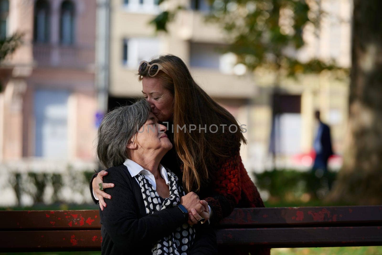 Elderly old cute woman with Alzheimer's very happy and smiling when eldest daughter hugs and takes care of her by dotshock