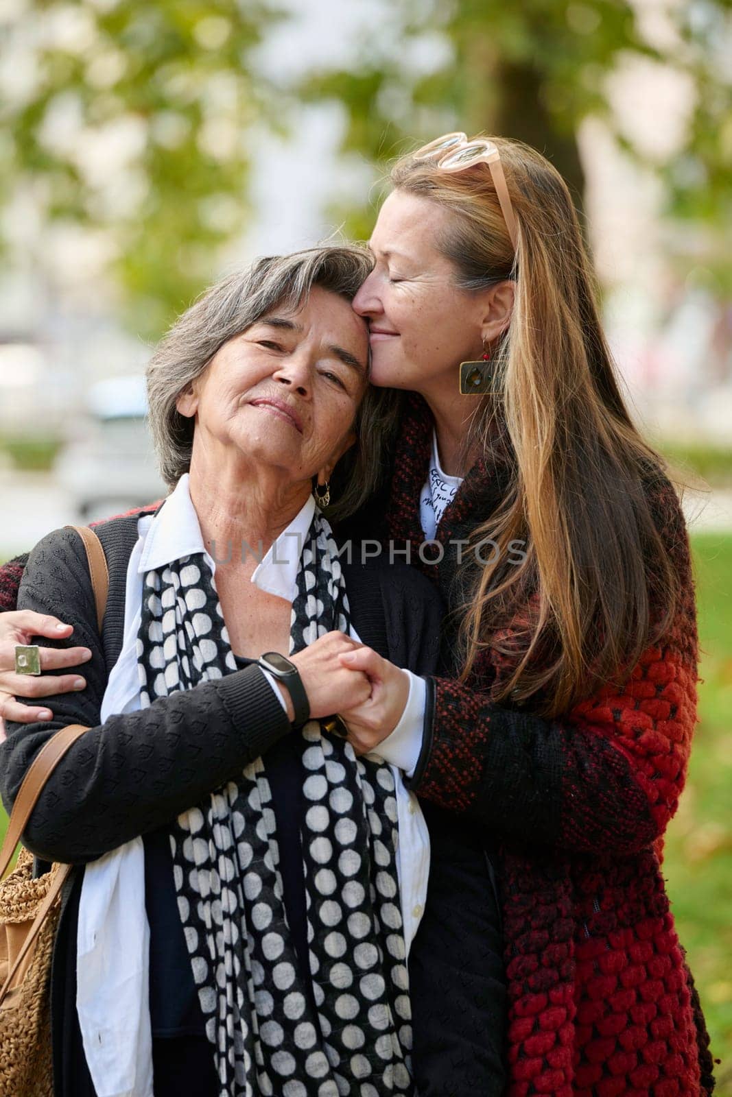 Elderly old cute woman with Alzheimer's very happy and smiling when eldest daughter hugs and takes care of her by dotshock