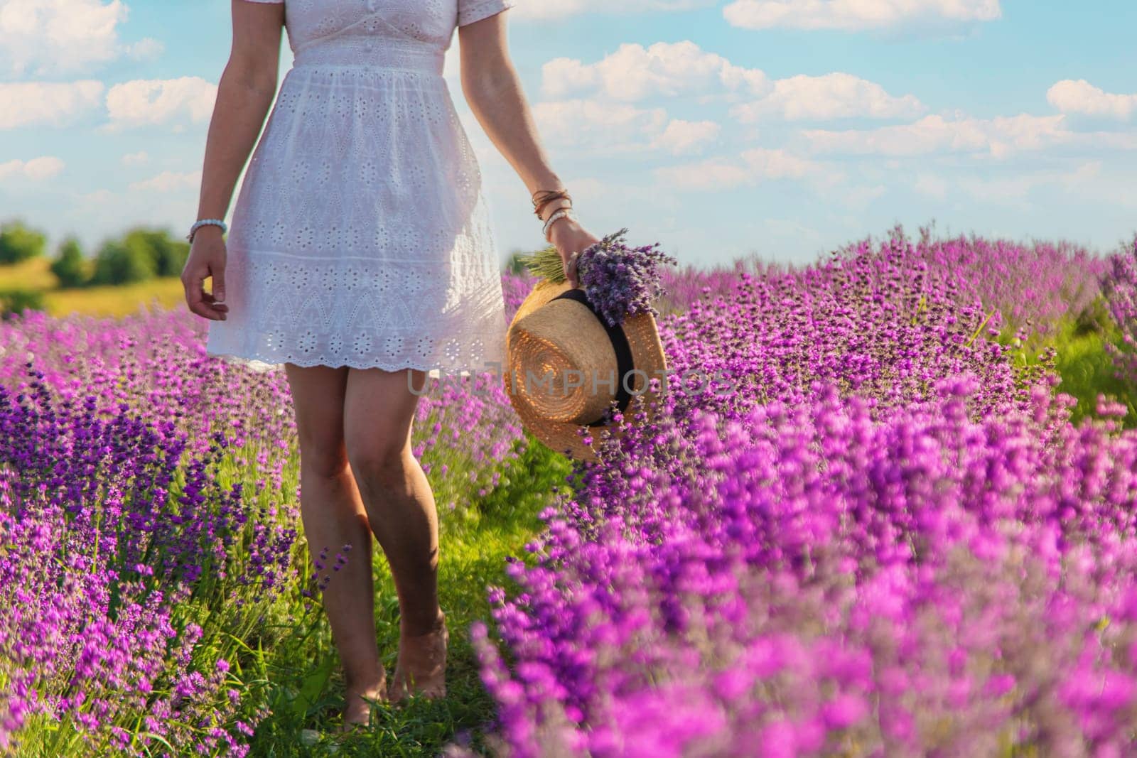 Woman in a lavender field. Selective focus. by yanadjana