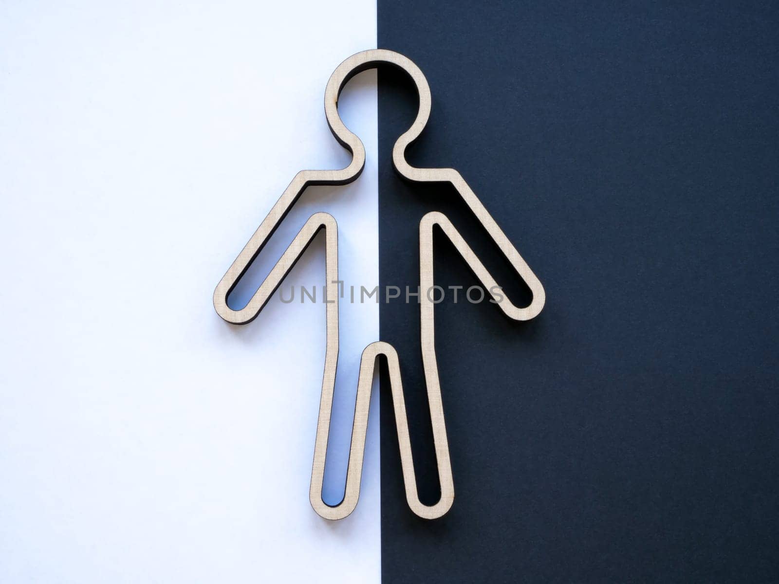 Split personality. Outline of a person on a white and black background. by designer491