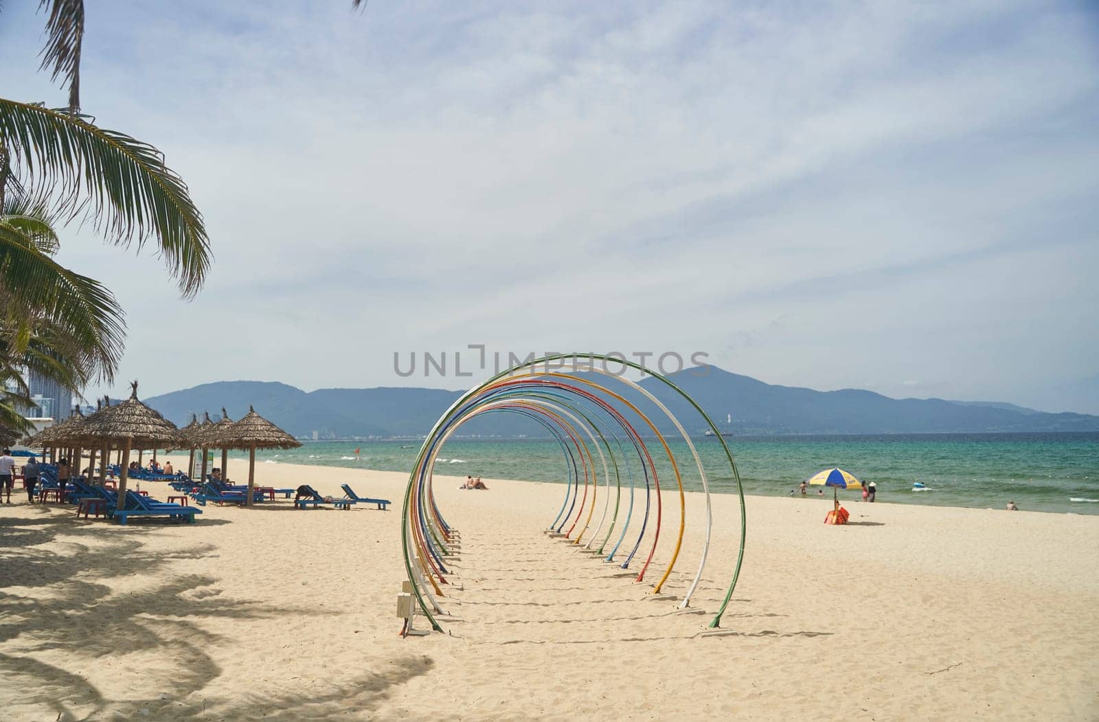 Da Nang, Vietnam - Juny 27, 2023: View of the seafronts on the south end of the golden sand beach My Khe, Danang beach on a sunny day. High quality photo