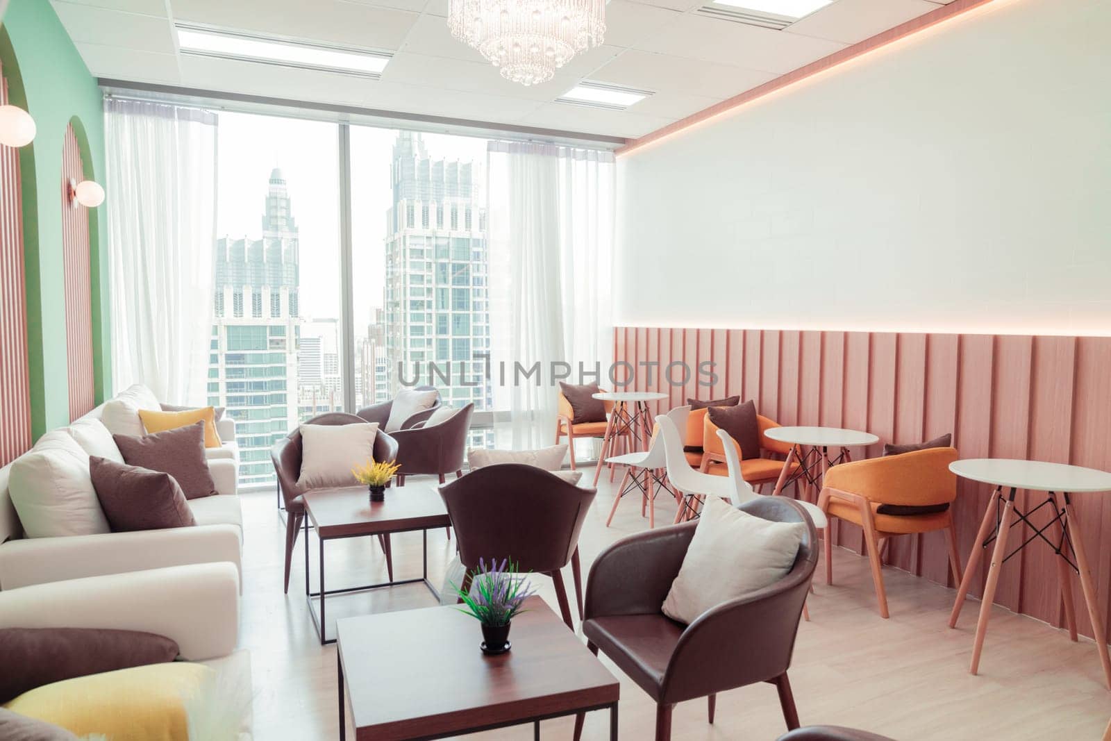 Empty stylish and modern office interior with skyscrapers view decorated with table, chair, botany decoration, elegant accessory. Living room. Modern interior. Creative design. Day light. Ornamented.