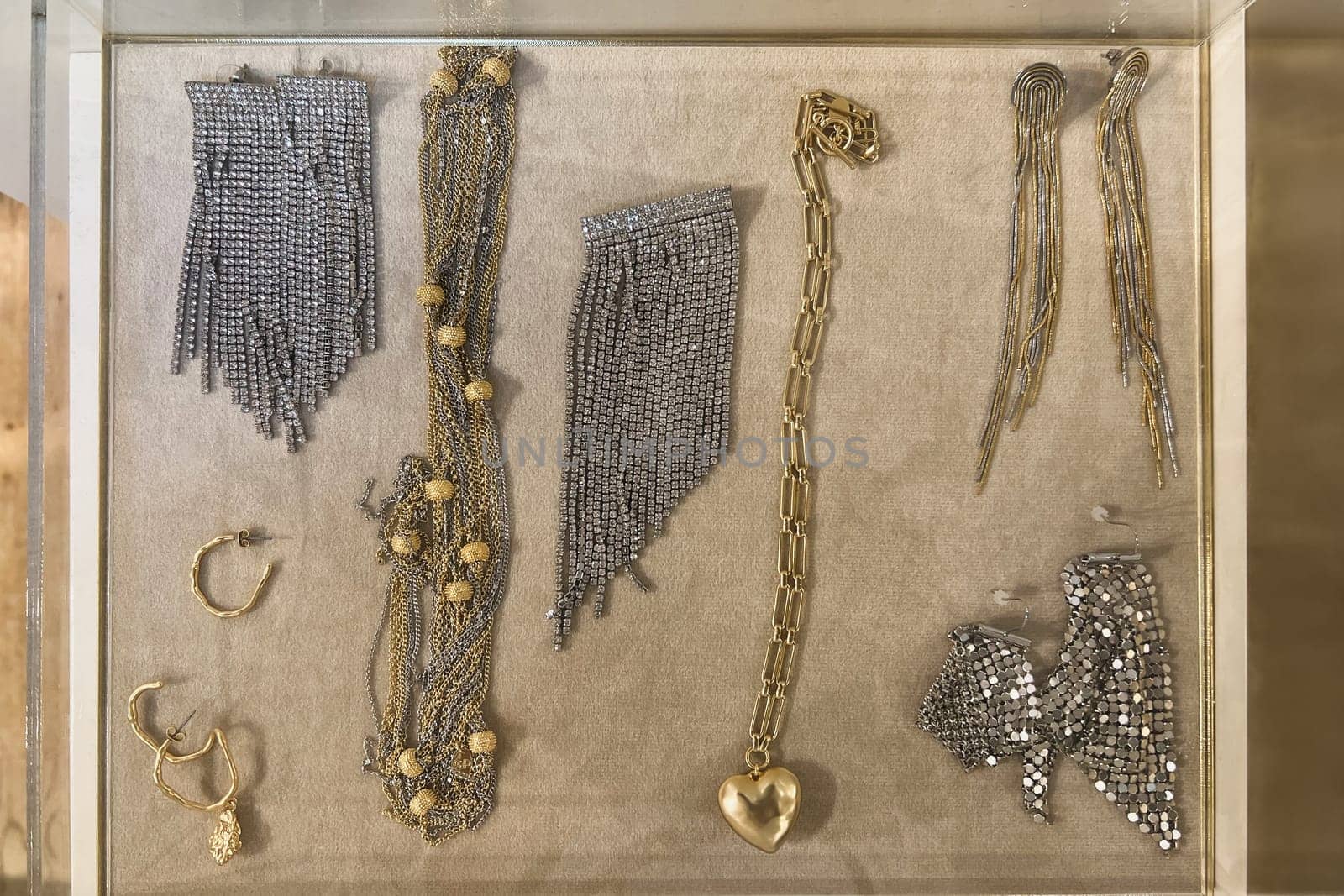 Chains, earrings, necklaces in a store window