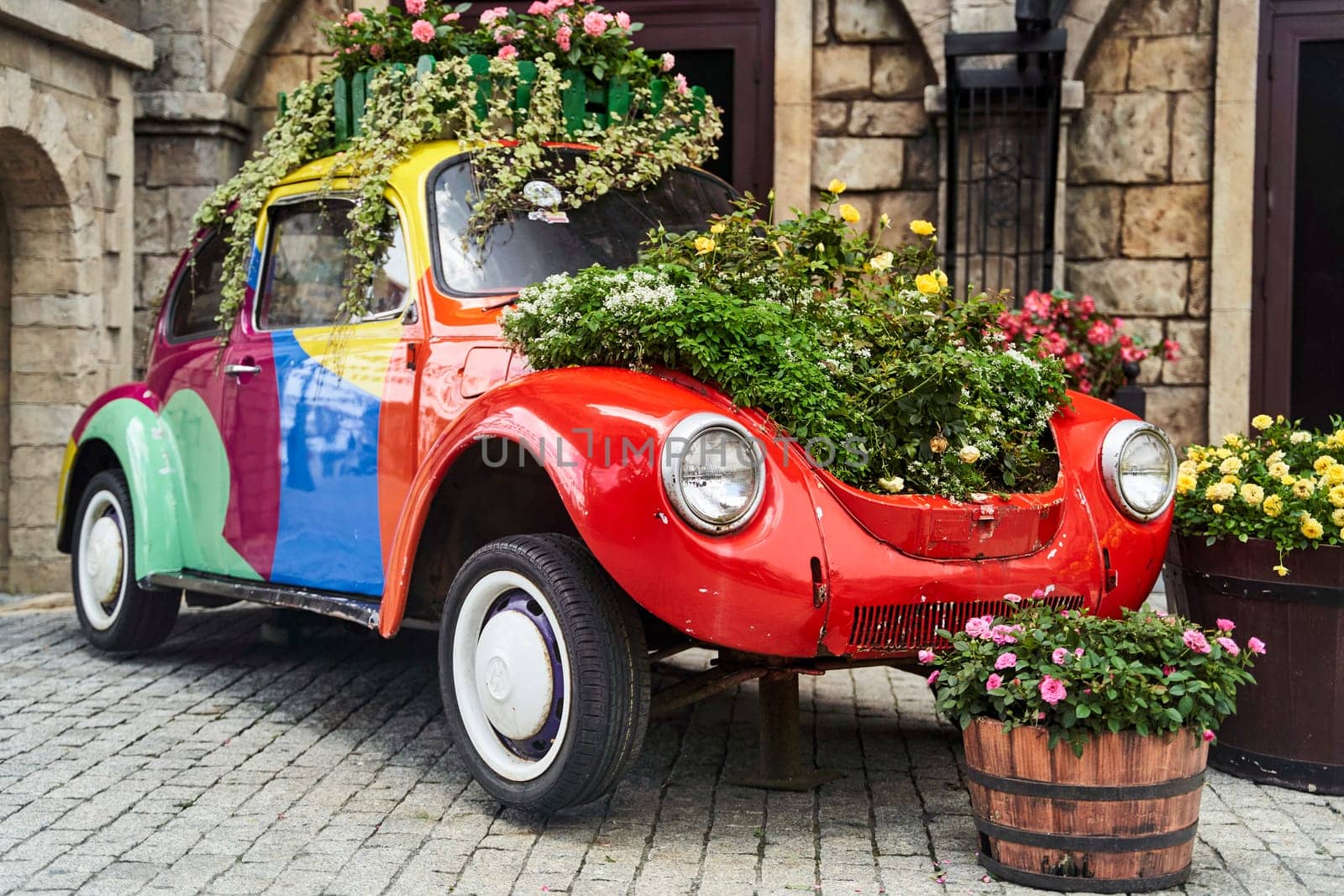 Vintage car decorated with flowers in the photo zone in a romantic style. High quality photo