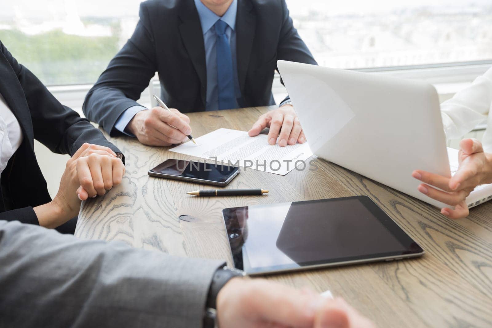 Business man signing contract at office table