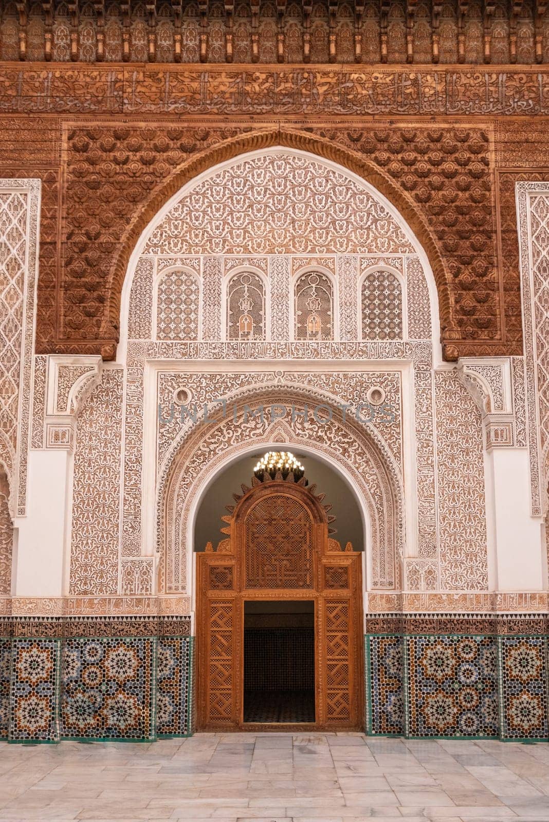 MARRAKECH, MOROCCO - APRIL 18, 2023 - Famous Madrassa Ben Youssef in the medina of Marrakech in Morocco by imagoDens
