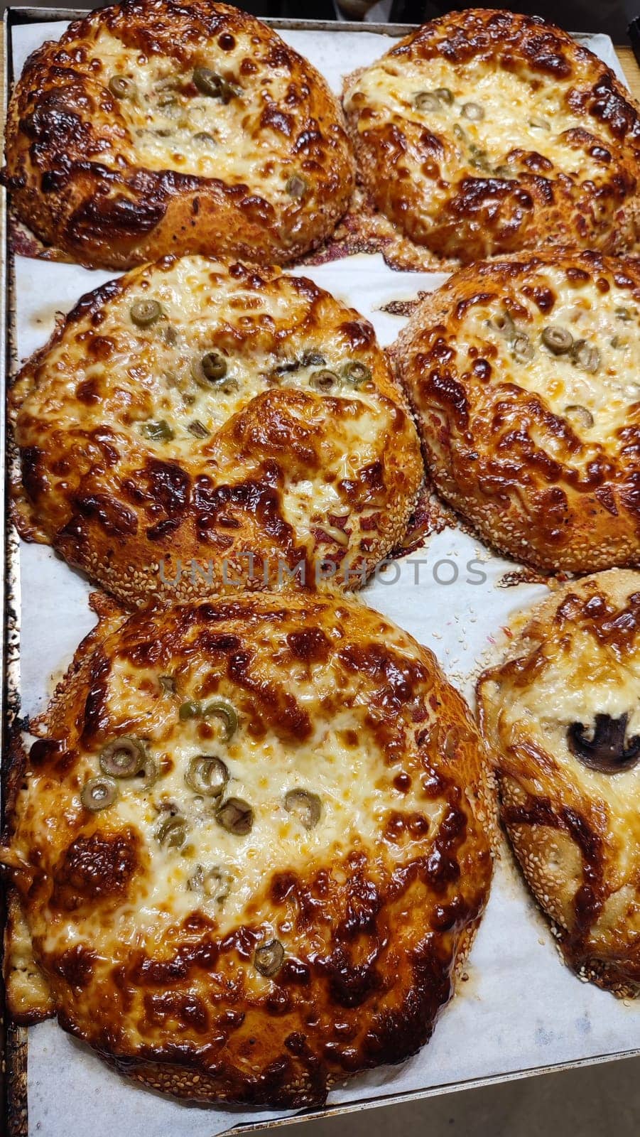 round pizza with eggplants and olives, food, baking, cooking. High quality photo