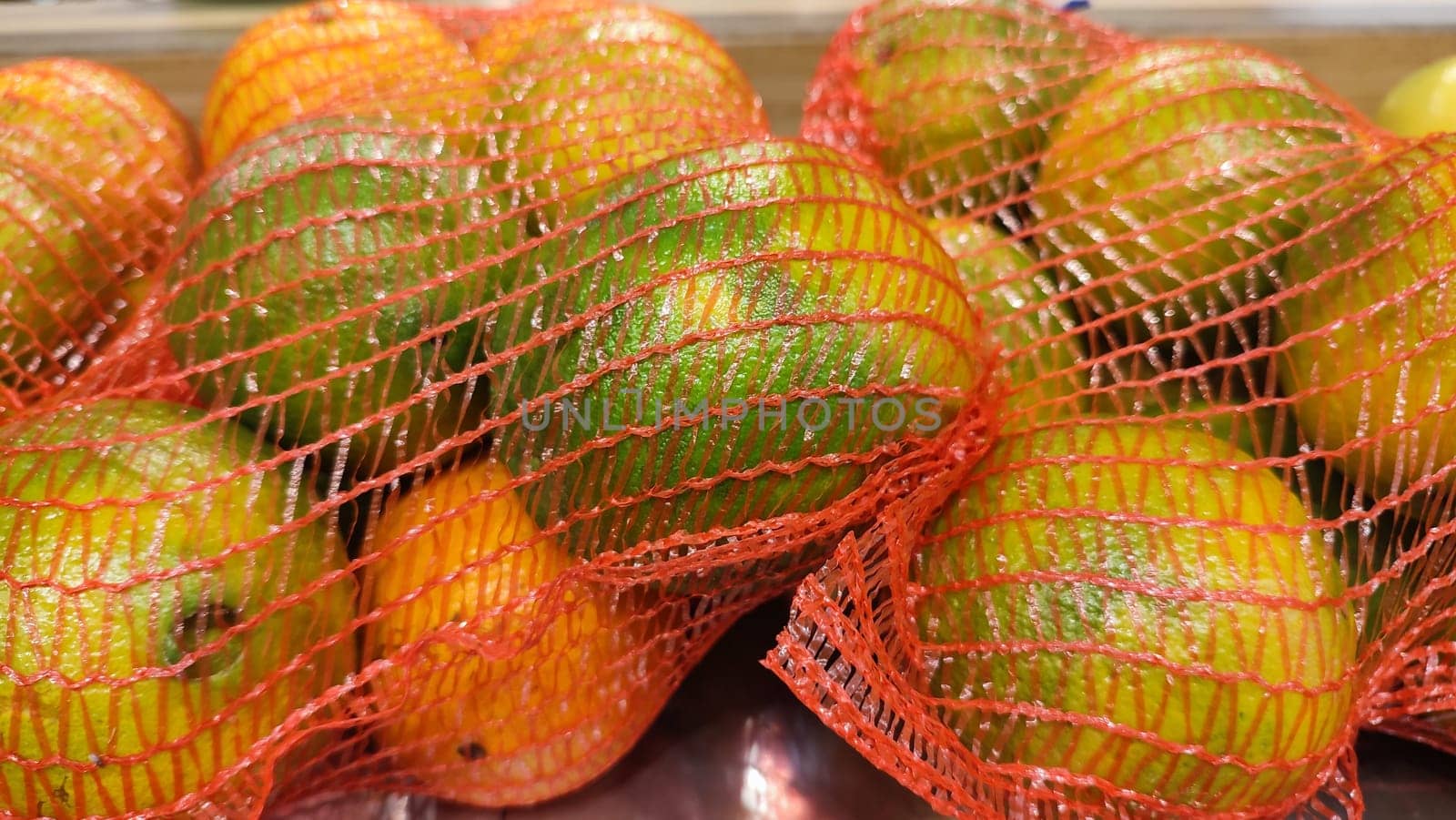 tangerines fresh fruit in a net, food, products. High quality photo