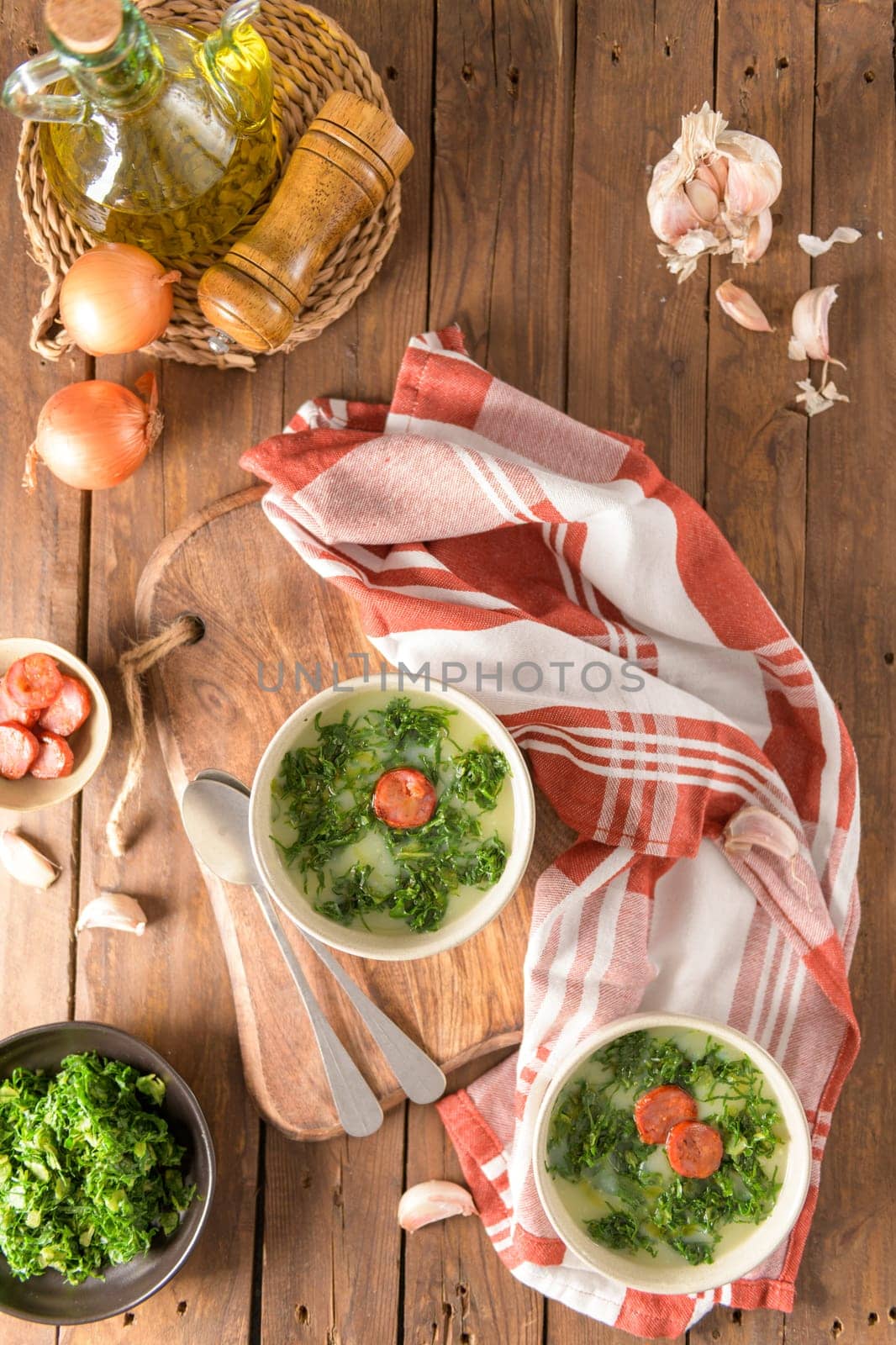 Caldo verde popular soup in Portuguese cuisine. traditional ingredients for caldo verde are potatoes, collard greens , olive oil and salt. Additionally garlic or onion may be added.