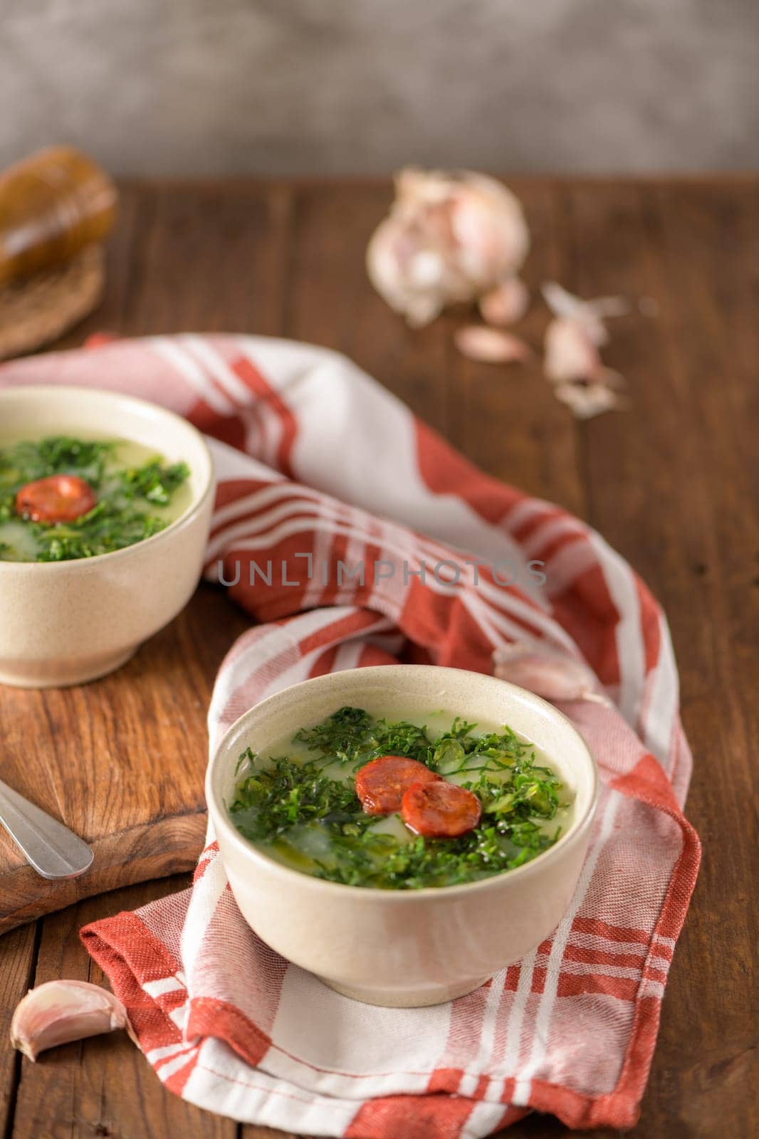 Caldo verde popular soup in Portuguese cuisine. traditional ingredients for caldo verde are potatoes, collard greens , olive oil and salt. Additionally garlic or onion may be added.