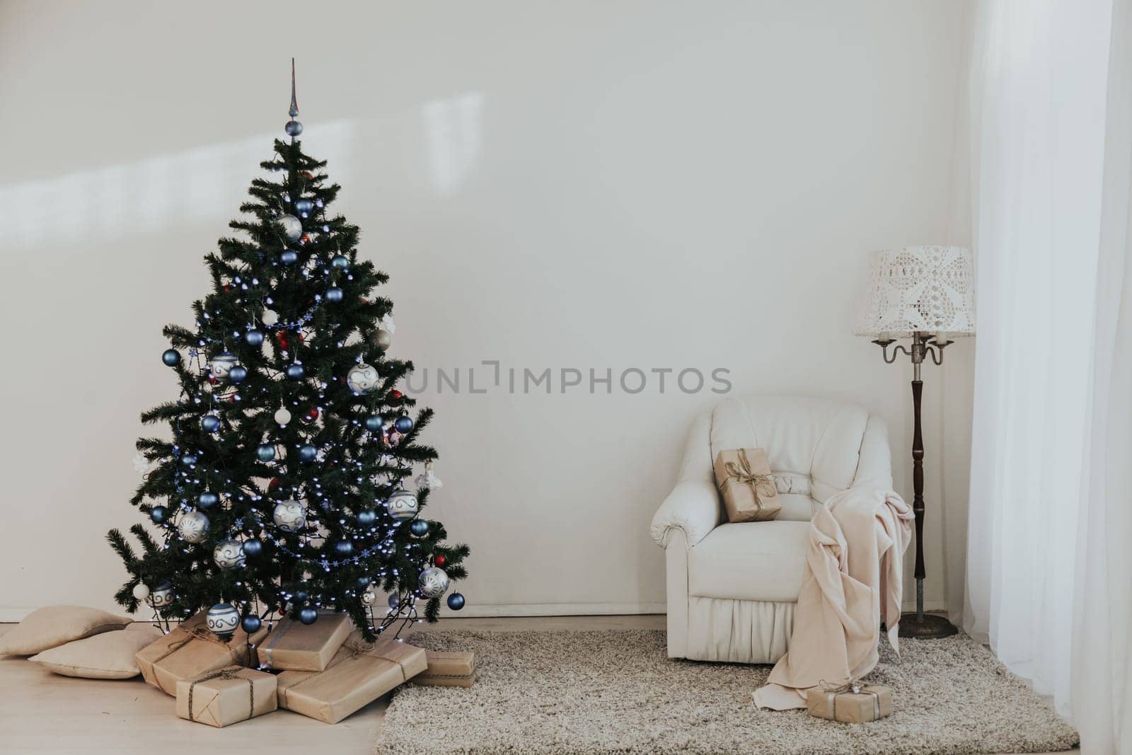 Christmas tree in a bright room new year gifts 1