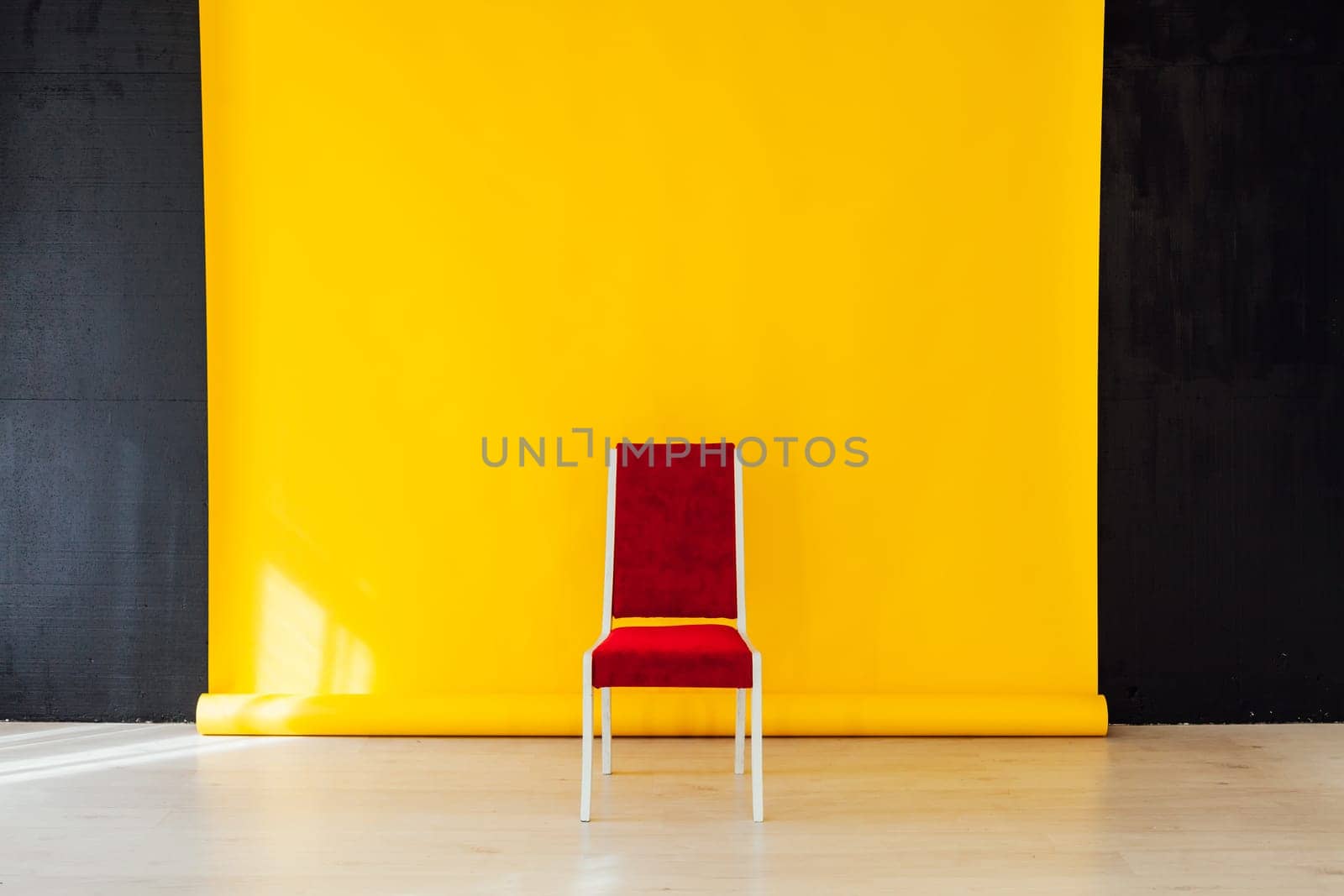 red chair in the interior of the room with a yellow background by Simakov