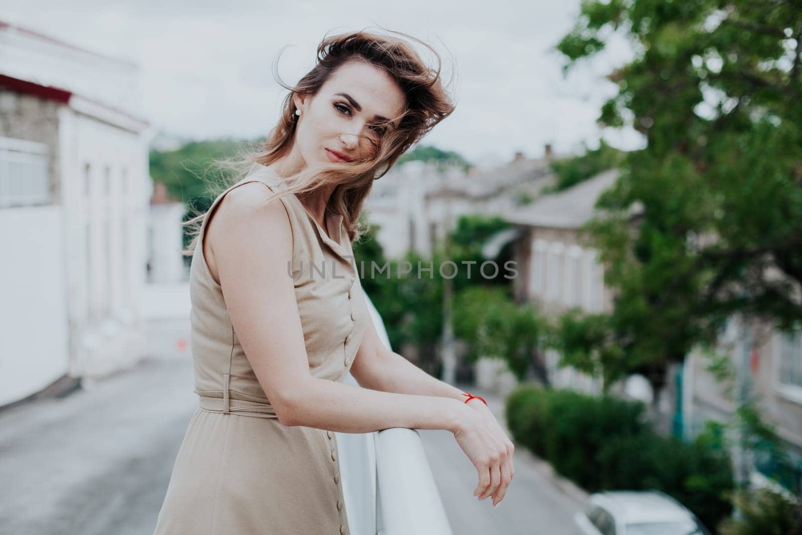 Portrait of a beautiful woman in a beige dress by Simakov