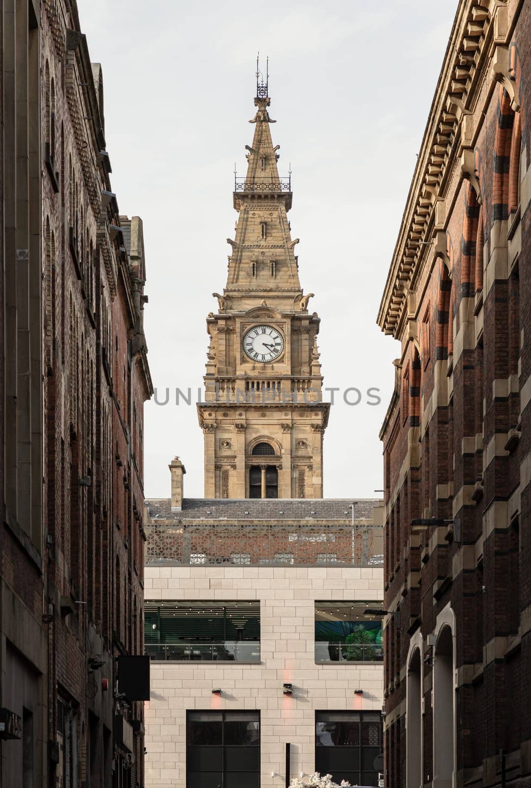 Liverpool, UK - Oct 07, 2023 - Vertical shot of Liverpool municipal building Clock tower on Dale street. Architecture exterior of The Municipal Hotel Liverpool, Space for text, Selective focus.