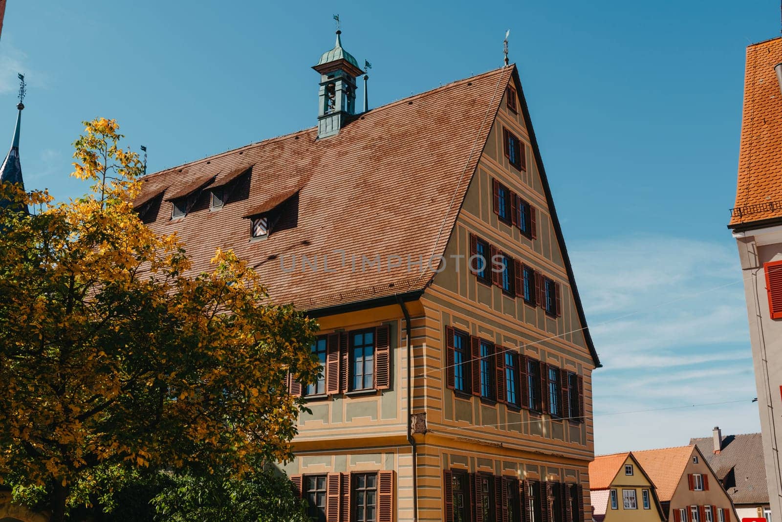 Old national German town house. Old Town is full of colorful and well preserved buildings. Baden-Wurttemberg is a state in southwest Germany bordering France and Switzerland. The Black Forest, known for its evergreen scenery and traditional villages, lies in the mountainous southwest. Stuttgart, the capital, is home to Wilhelma, a royal estate turned zoo and gardens. Porsche and Mercedes-Benz have headquarters and museums there. The 19th-century Hohenzollern Castle sits in the Swabian Alps to the south.