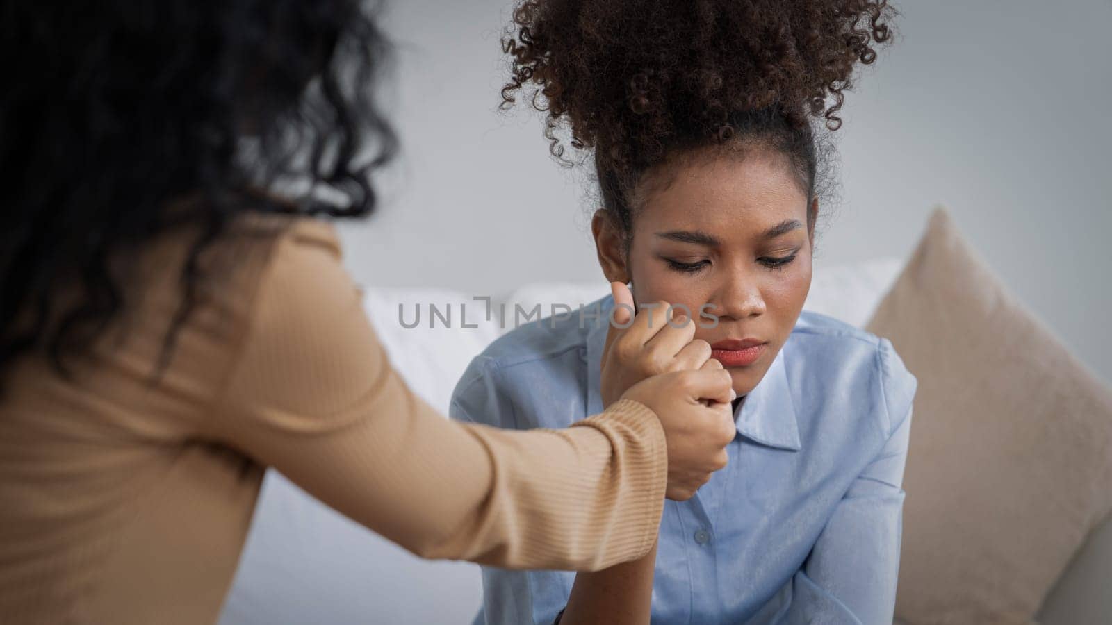 Sad PTSD woman patient in crucial therapy for mental health with psychologist, depression or grief after life failure. Frustrated trauma young woman talking to a psychologist about emotion in clinic