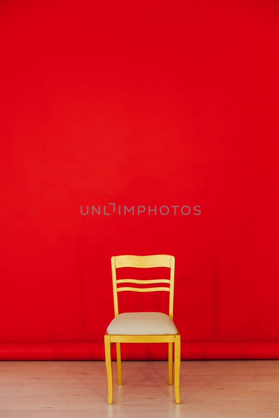 Yellow chair gift in the interior of the red room by Simakov