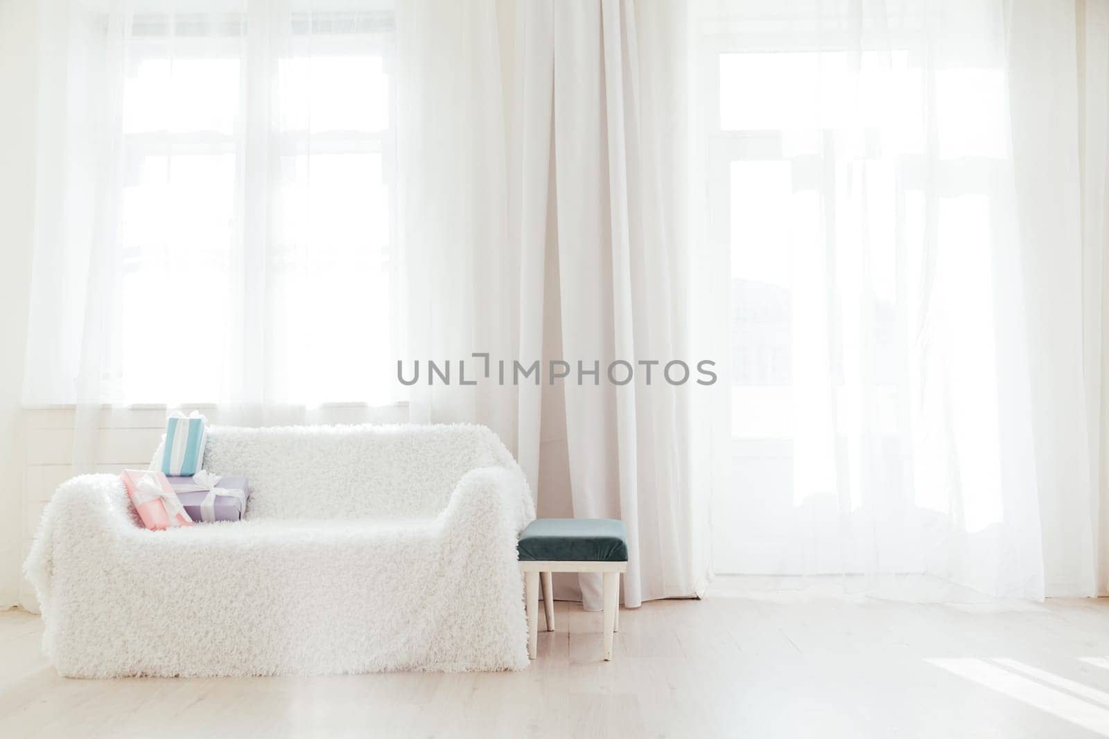 white sofa with birthday gifts in the interior of the room