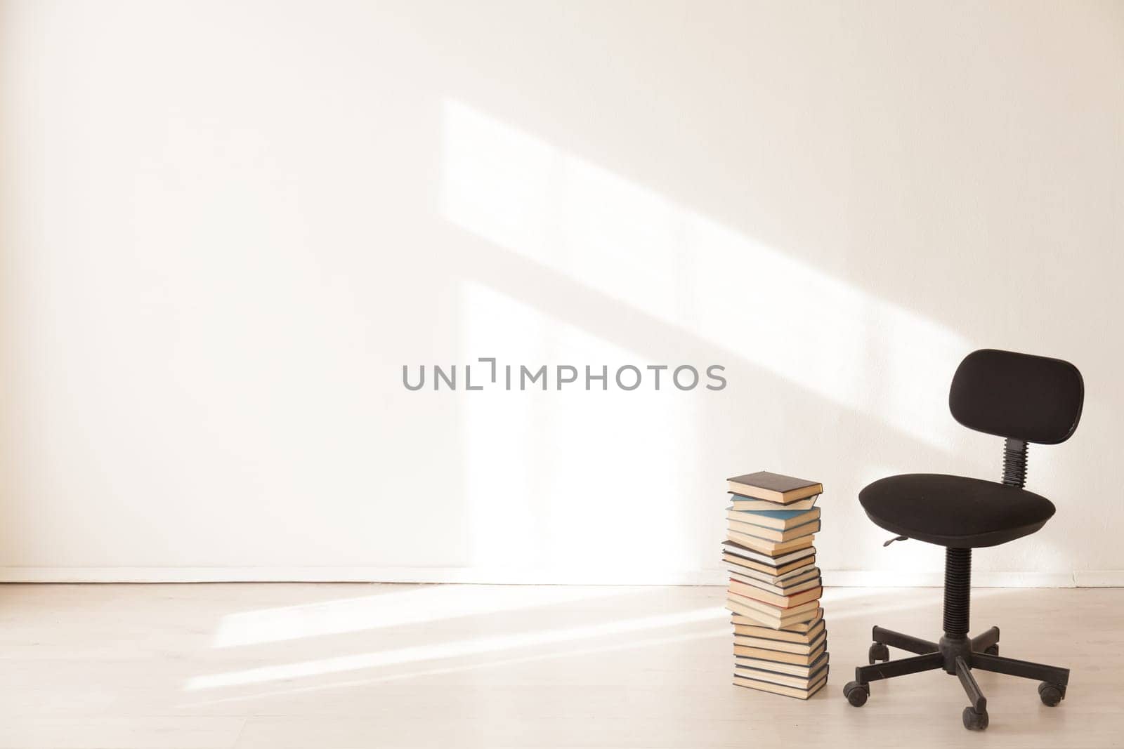 black office chair with a gift in an empty office