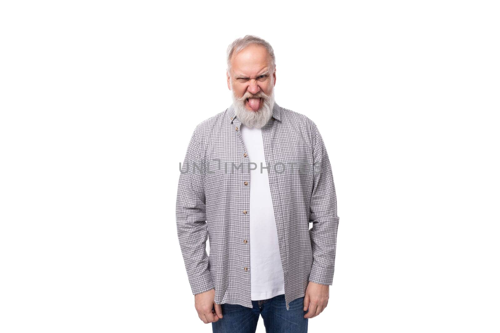 handsome gray-haired elderly man with a beard in a checkered shirt on a white background with copy space.
