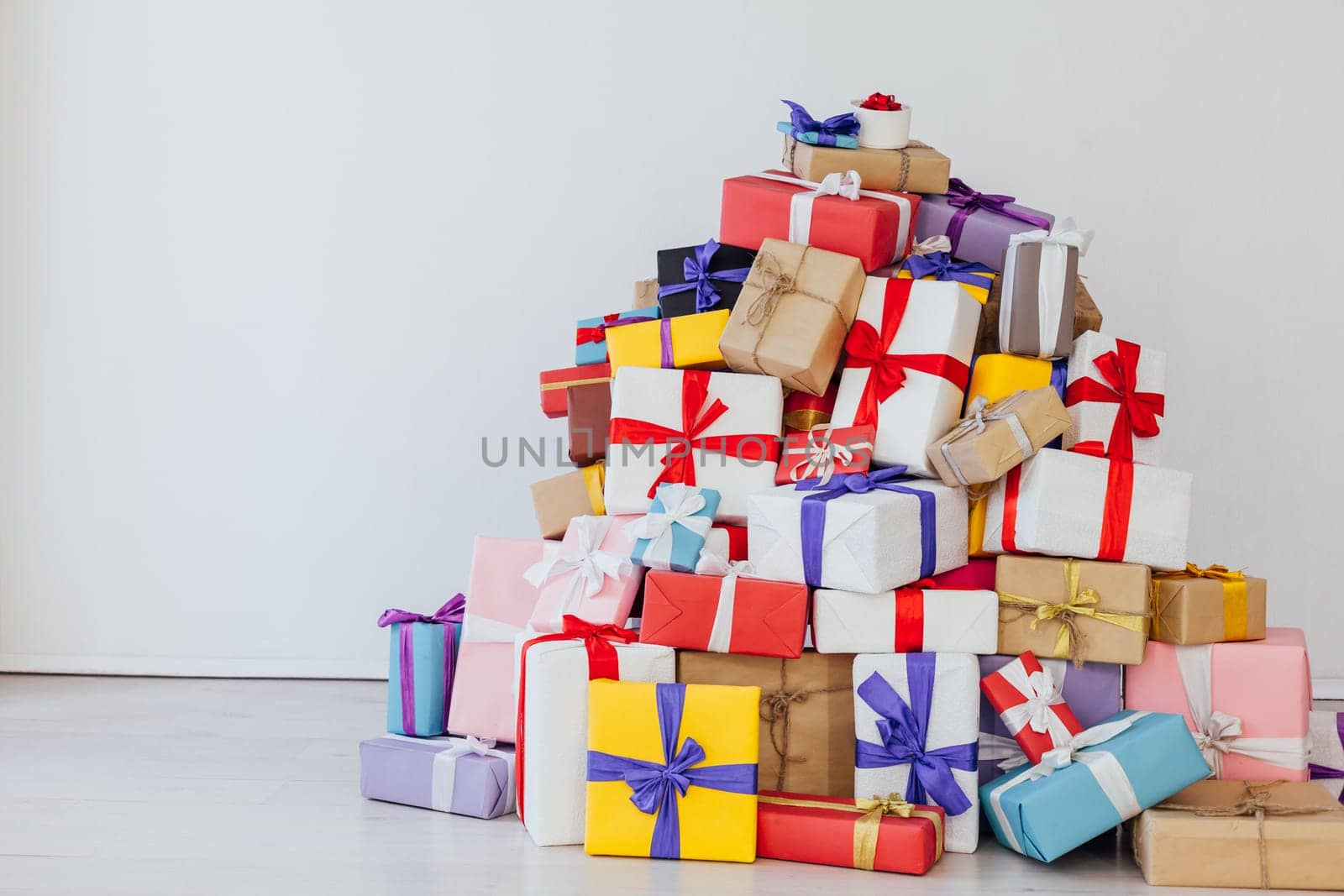 Lots of multicolored birthday presents New Year Christmas on a white background by Simakov