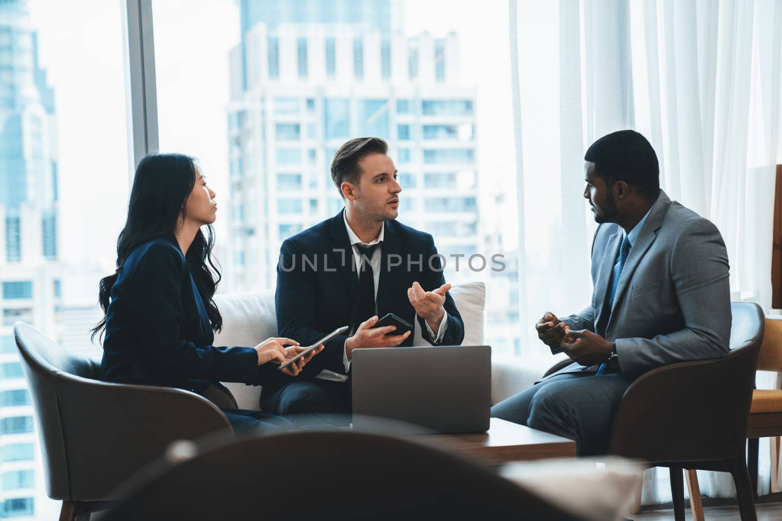 Young smart businesswoman showing data analysis to diverse investor by using tablet. Multicultural business group discussing and investing in start up project. Modern office. Meeting. Ornamented.