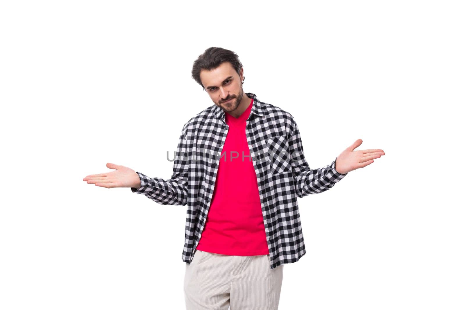 young nice european brutal guy with gorgeous hair and beard on a white background with copy space.