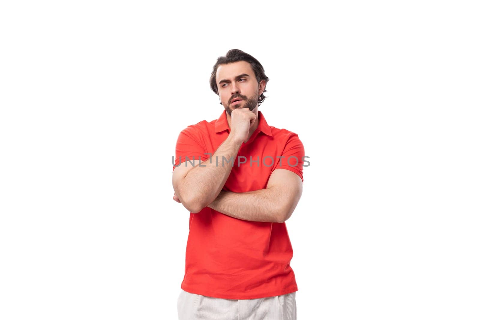 young handsome caucasian brunette man with a well-groomed beard dressed in red clothes. people lifestyle concept by TRMK