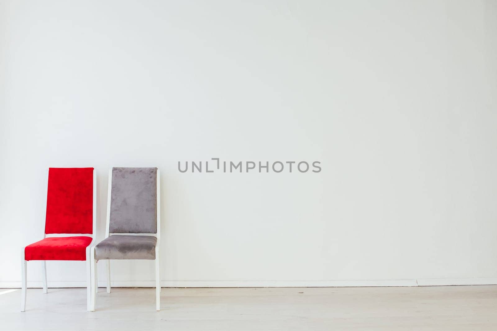 two vintage chairs in an empty white room by Simakov