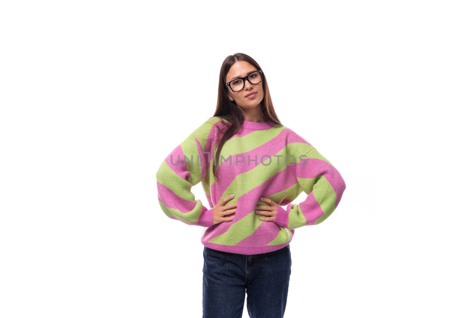 well-groomed pleasant smiling young european brunette woman dressed in a casual striped pink-green pullover by TRMK